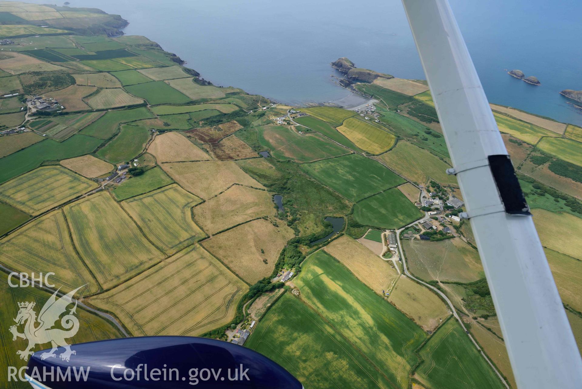 RCAHMW colour oblique aerial photograph of Portheiddy cropmarks taken on 11 July 2018 by Toby Driver