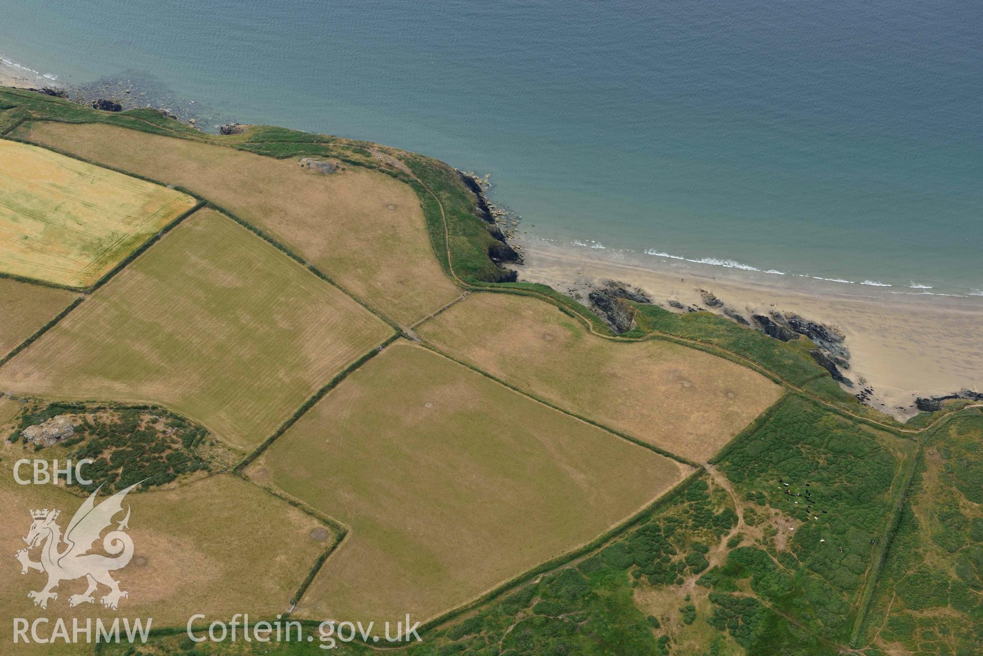 RCAHMW colour oblique aerial photograph of Coastline at Carn Llwyd north east of Porth Sele taken on 11 July 2018 by Toby Driver