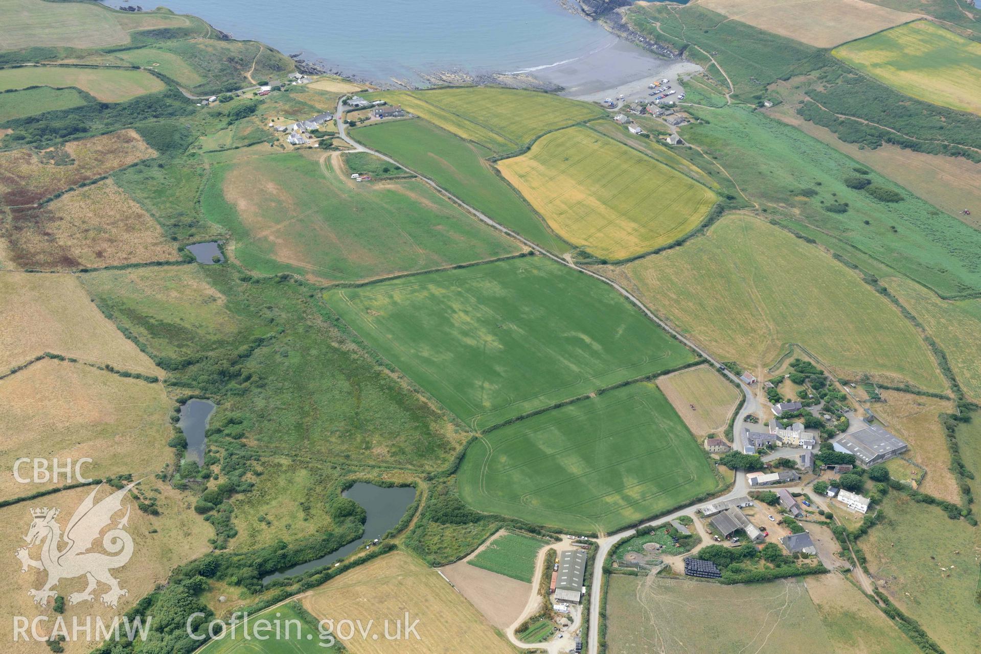 RCAHMW colour oblique aerial photograph of Portheiddy cropmarks taken on 11 July 2018 by Toby Driver