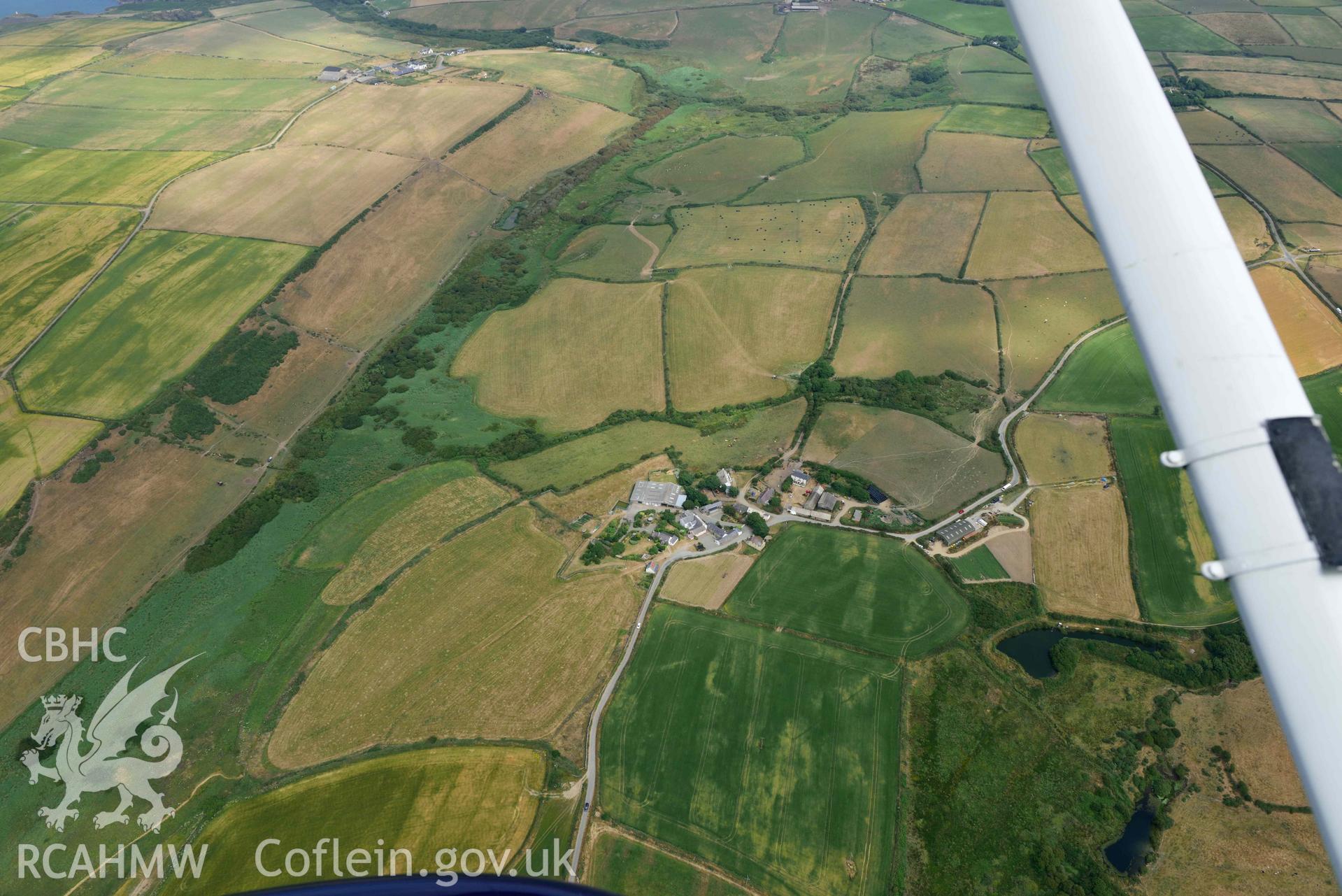 RCAHMW colour oblique aerial photograph of Portheiddy cropmarks taken on 11 July 2018 by Toby Driver