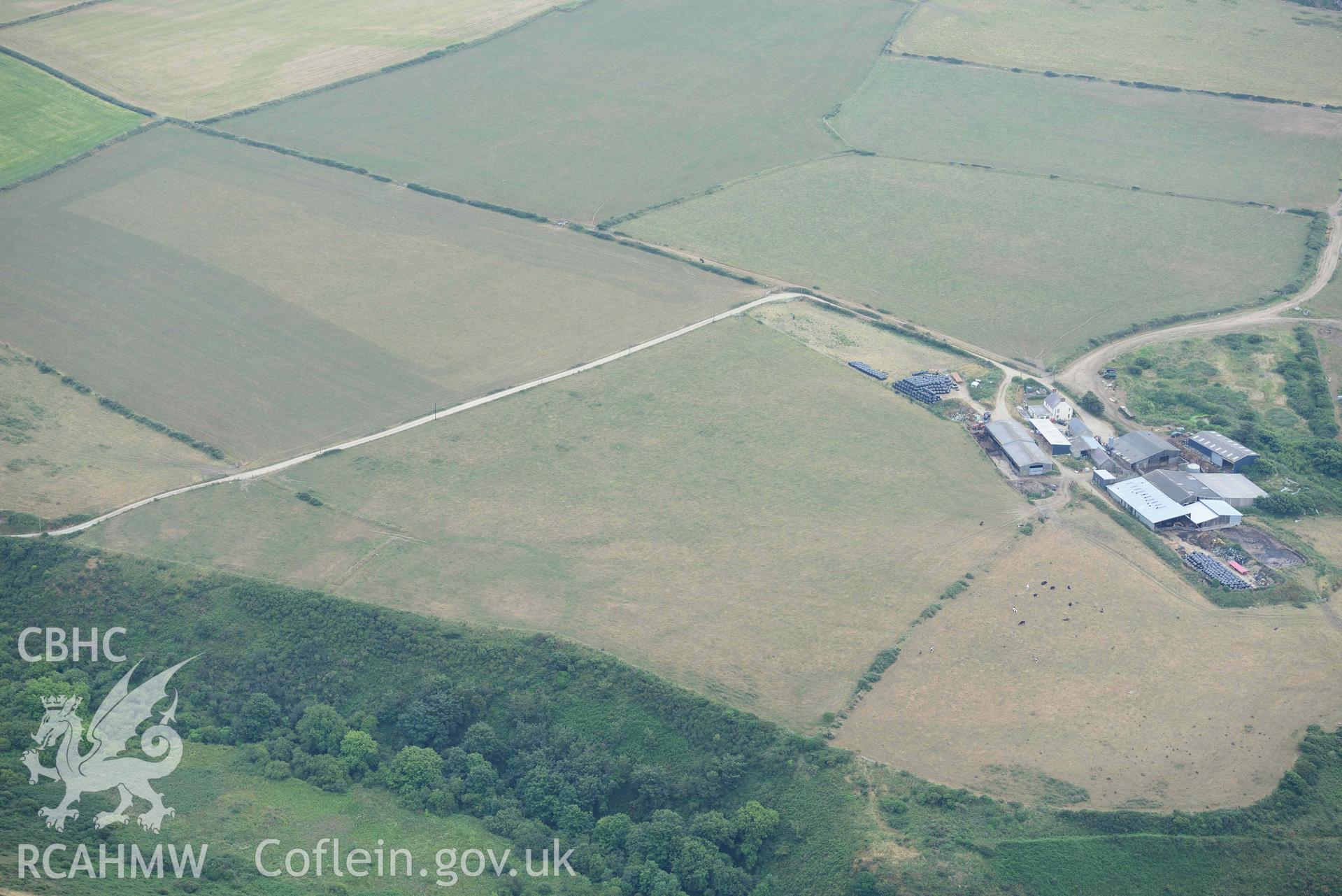 RCAHMW colour oblique aerial photograph of  St Elvis Promontory Fort taken on 11 July 2018 by Toby Driver