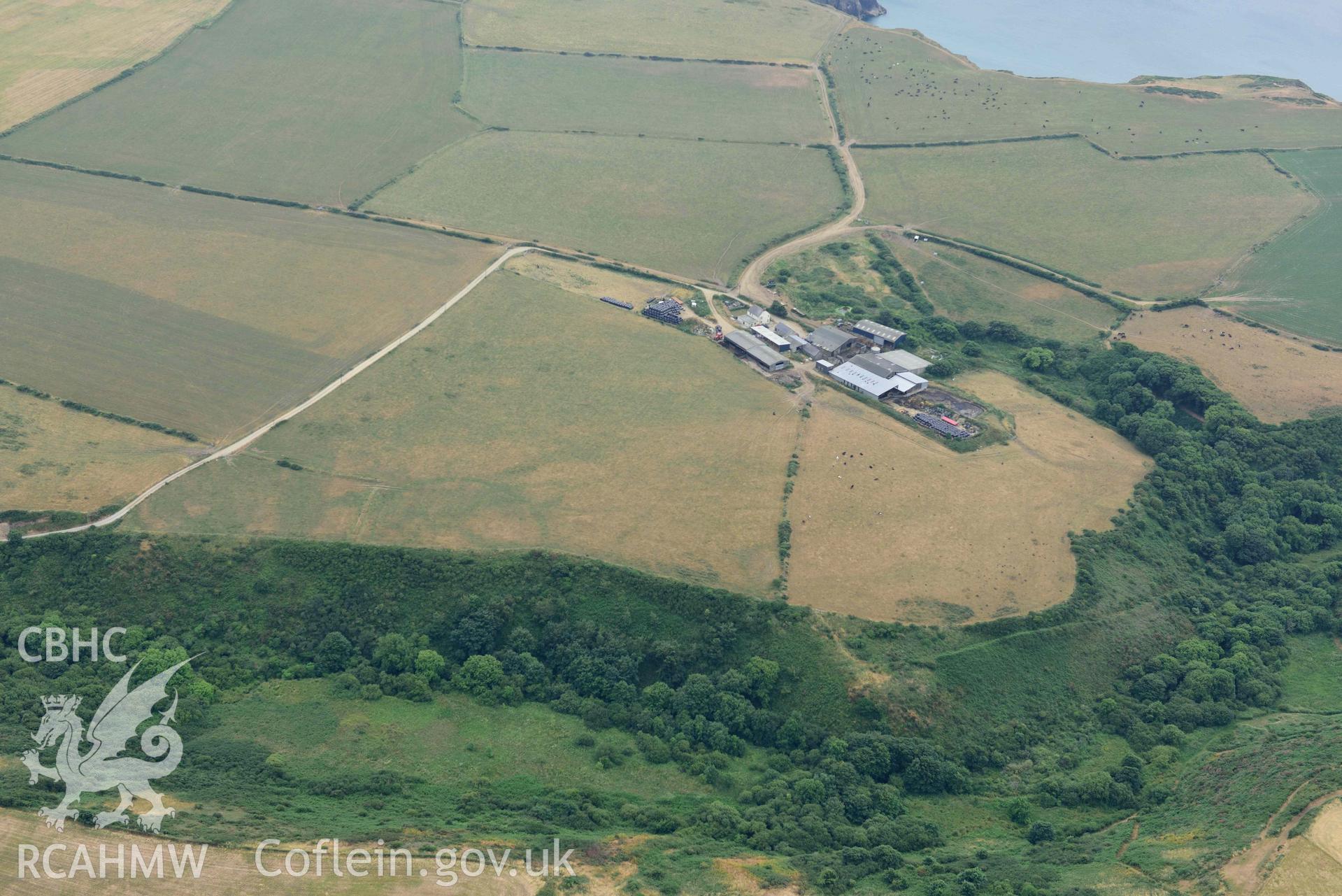 RCAHMW colour oblique aerial photograph of  St Elvis Promontory Fort  taken on 11 July 2018 by Toby Driver