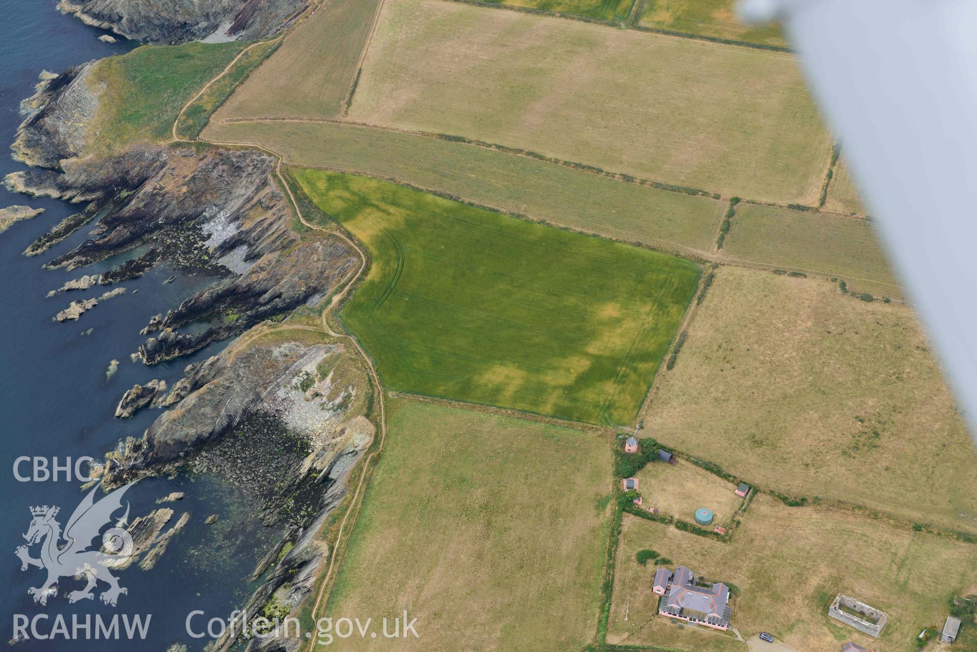 RCAHMW colour oblique aerial photograph of St Justinian's chapel, geological cropmarks NW of taken on 11 July 2018 by Toby Driver