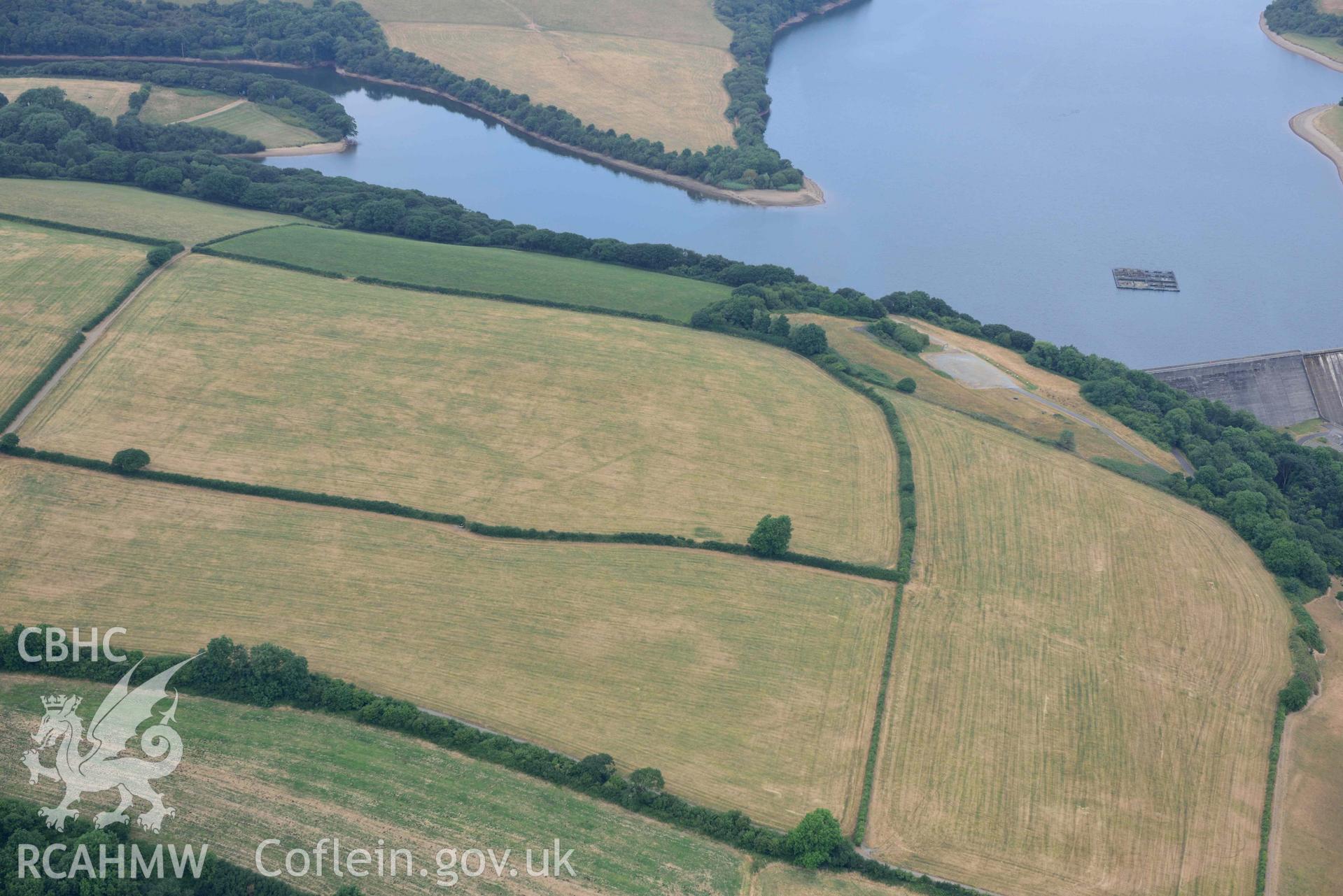 RCAHMW colour oblique aerial photograph of Llys y Fran Walton wood enclosures taken on 11 July 2018 by Toby Driver