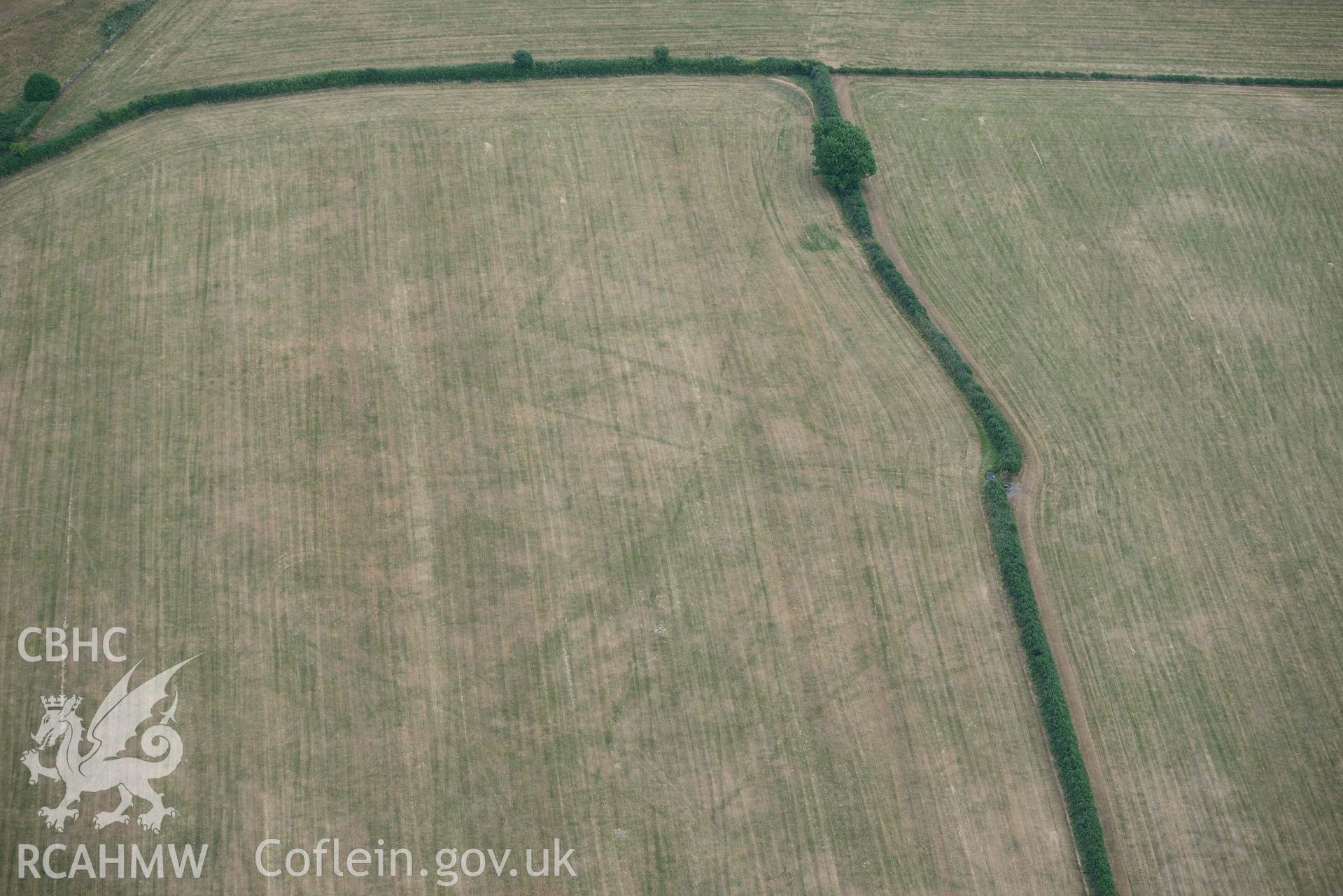 RCAHMW colour oblique aerial photograph of Llys y Fran Walton wood enclosures taken on 11 July 2018 by Toby Driver