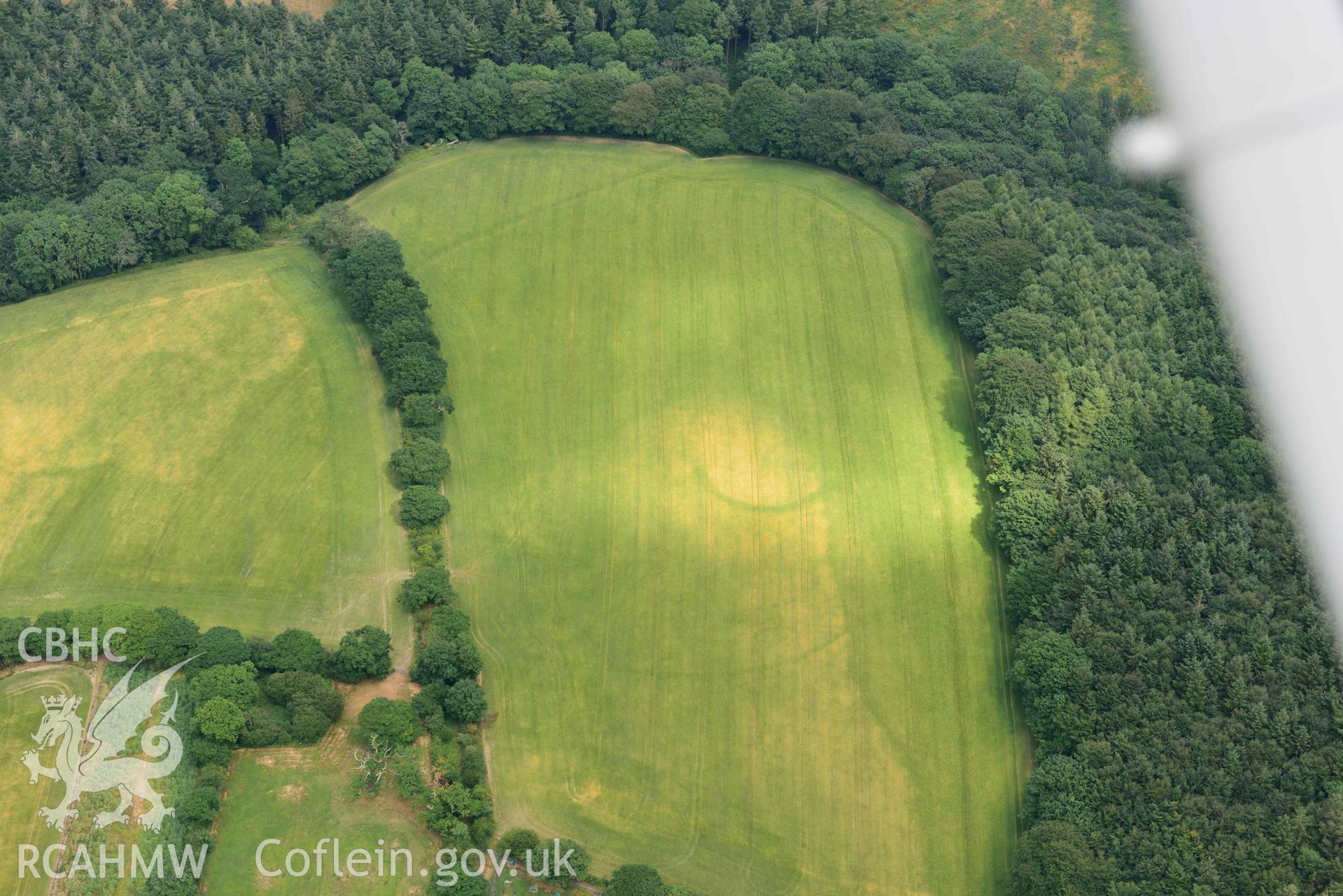 RCAHMW colour oblique aerial photograph of Rosehill defended enclosure taken on 11 July 2018 by Toby Driver