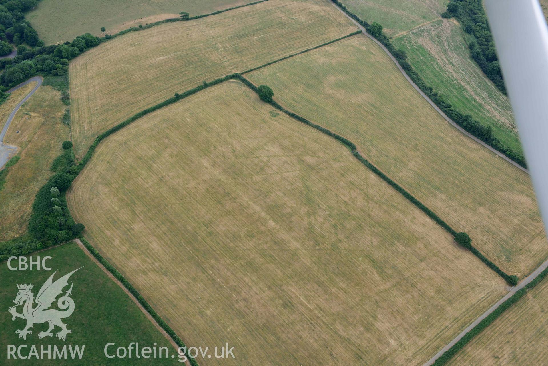 RCAHMW colour oblique aerial photograph of Llys y Fran Walton wood enclosures taken on 11 July 2018 by Toby Driver