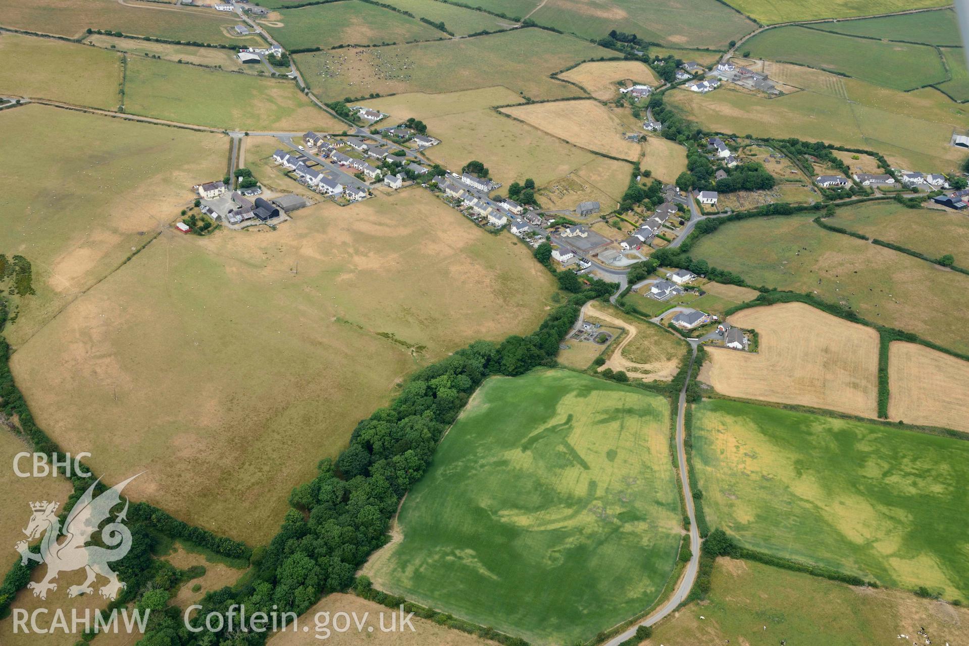 RCAHMW colour oblique aerial photograph of Ty Gwyn enclosure cropmark taken on 11 July 2018 by Toby Driver