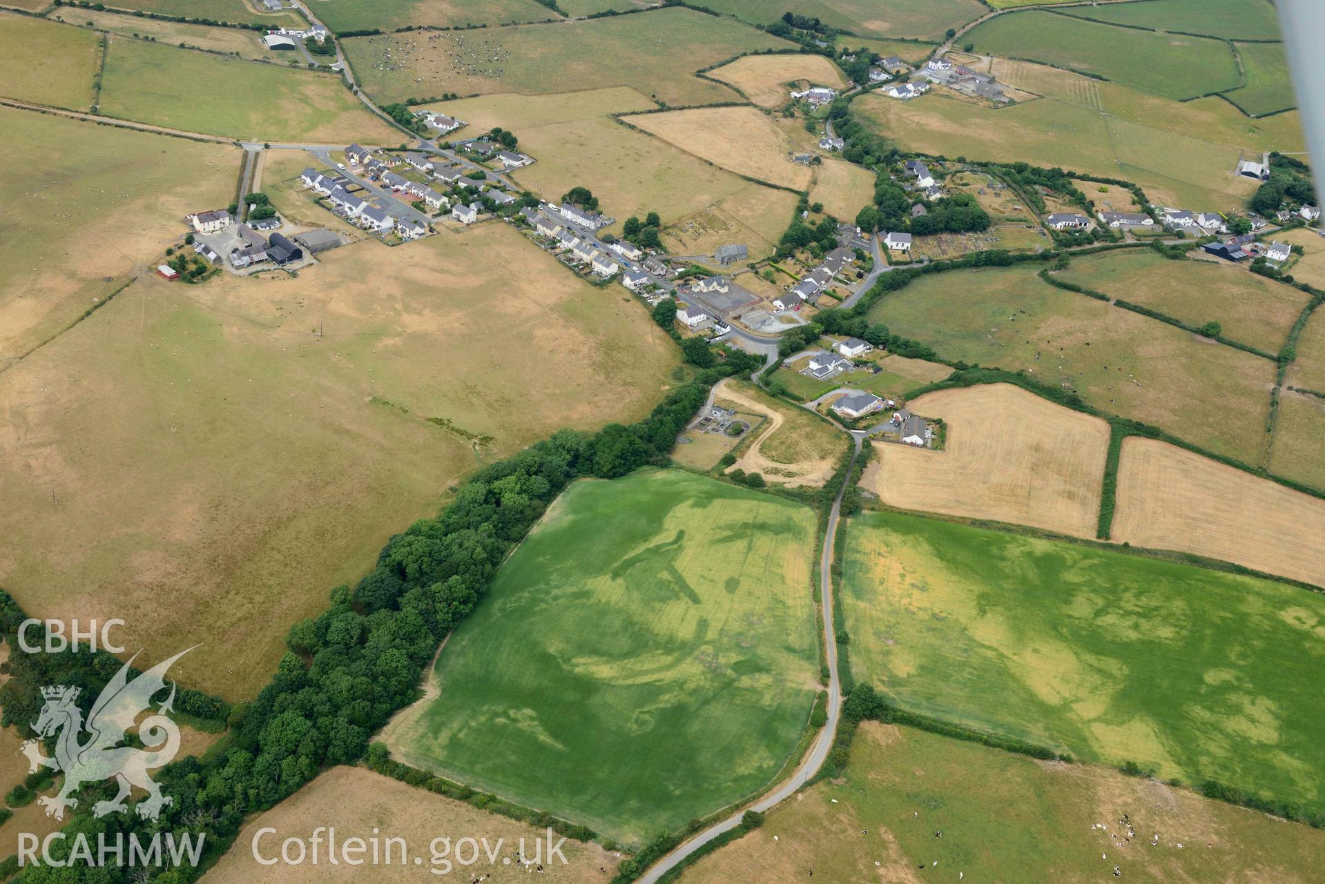 RCAHMW colour oblique aerial photograph of Ty Gwyn enclosure cropmark taken on 11 July 2018 by Toby Driver