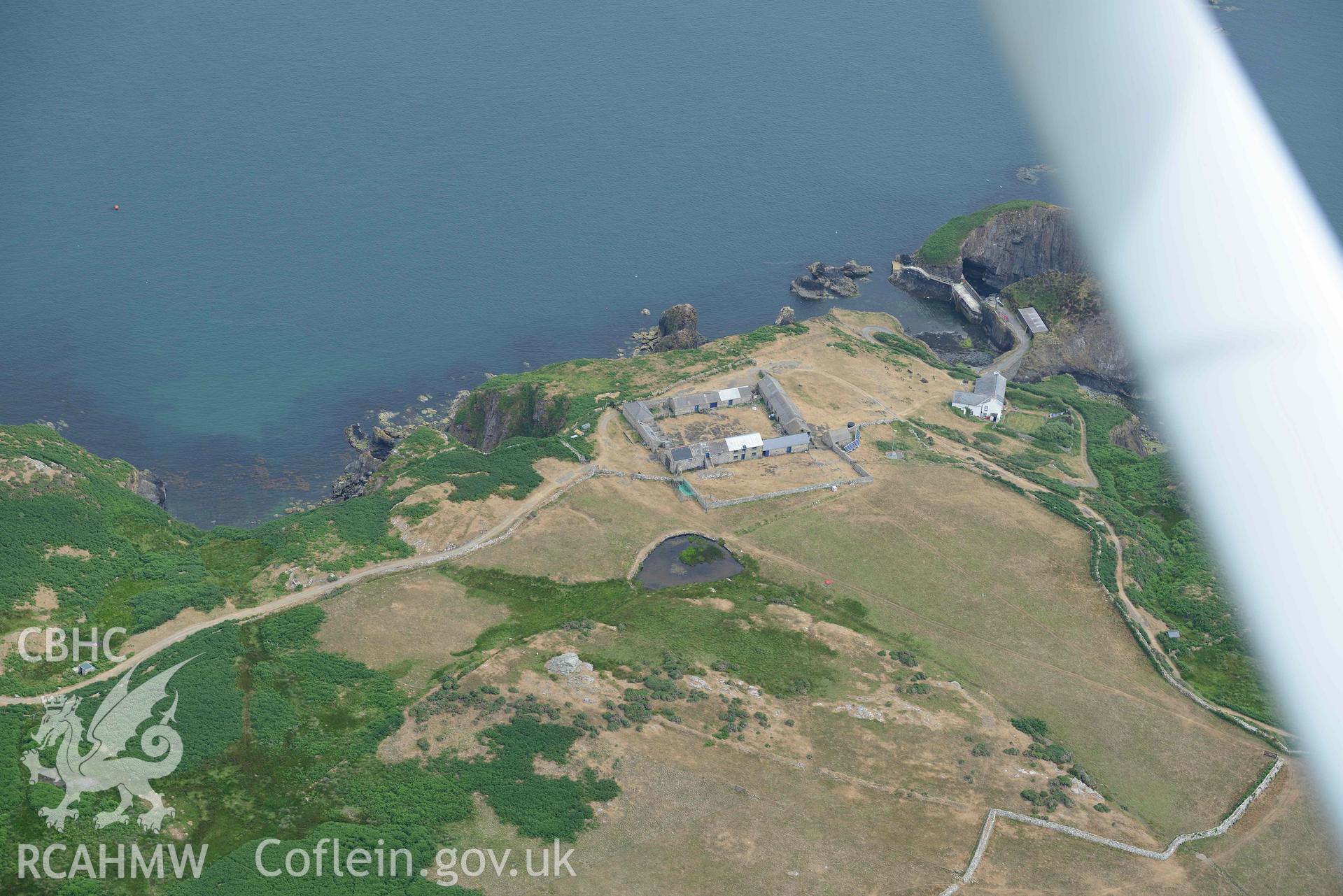 RCAHMW colour oblique aerial photograph of Ramsey Island, Ramsey Island Farm and St Tyfanog's chapel taken on 11 July 2018 by Toby Driver