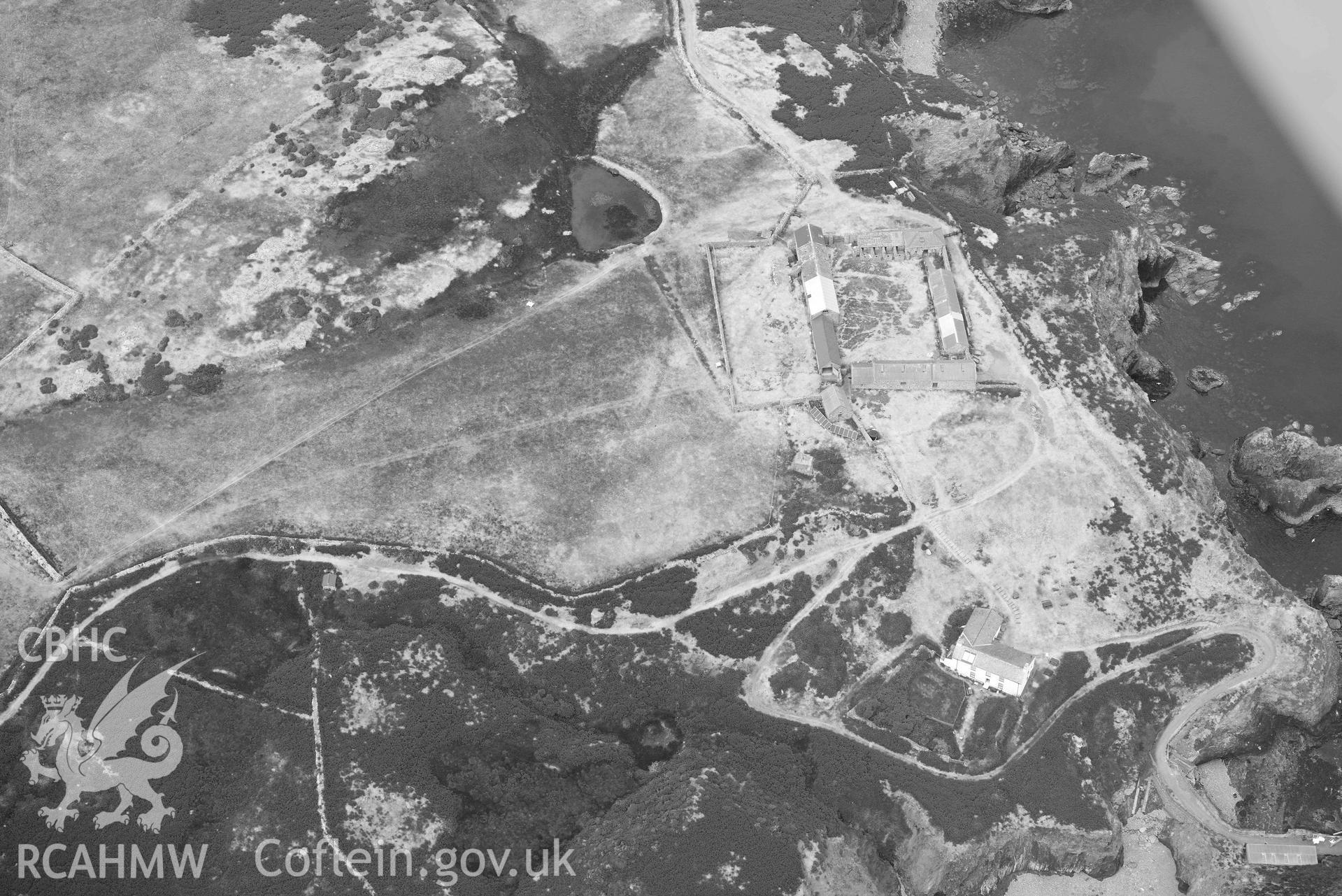 RCAHMW black and white oblique aerial photograph of Ramsey Island, Ramsey Island Farm and St Tyfanog's chapel taken on 11 July 2018 by Toby Driver