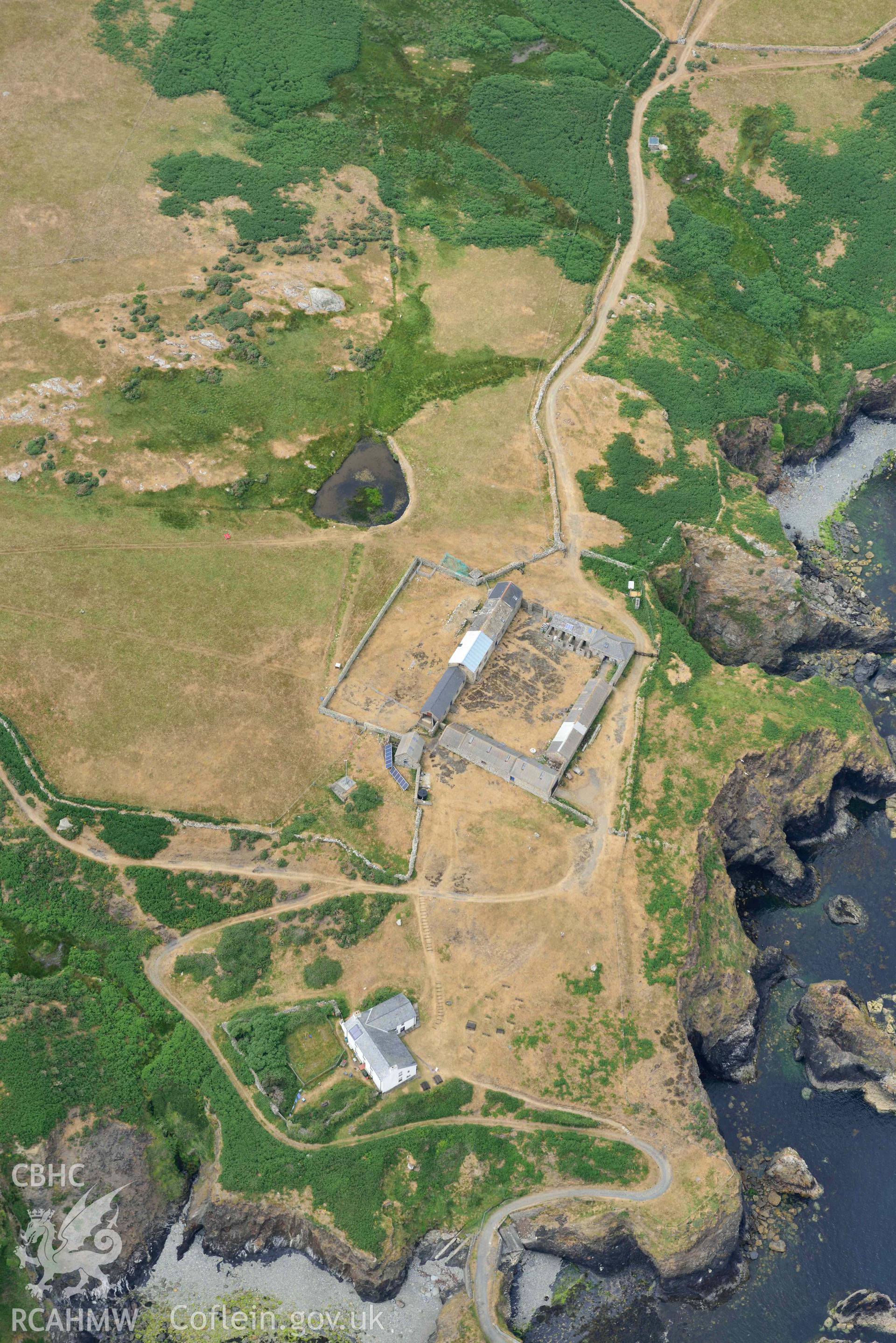 RCAHMW colour oblique aerial photograph of Ramsey Island, Ramsey Island Farm and St Tyfanog's chapel taken on 11 July 2018 by Toby Driver