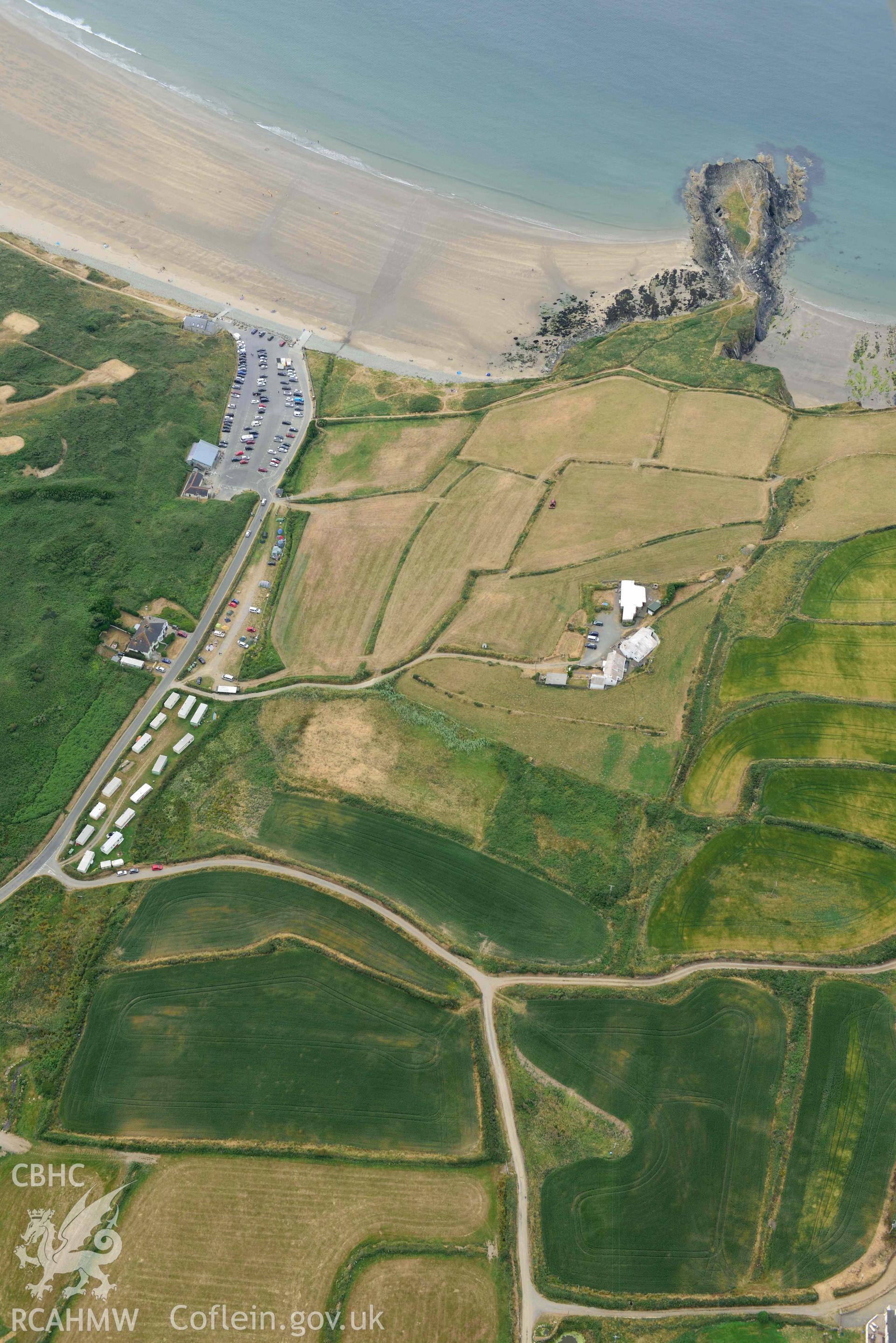 RCAHMW colour oblique aerial photograph of  St Patrick's Chapel taken on 11 July 2018 by Toby Driver