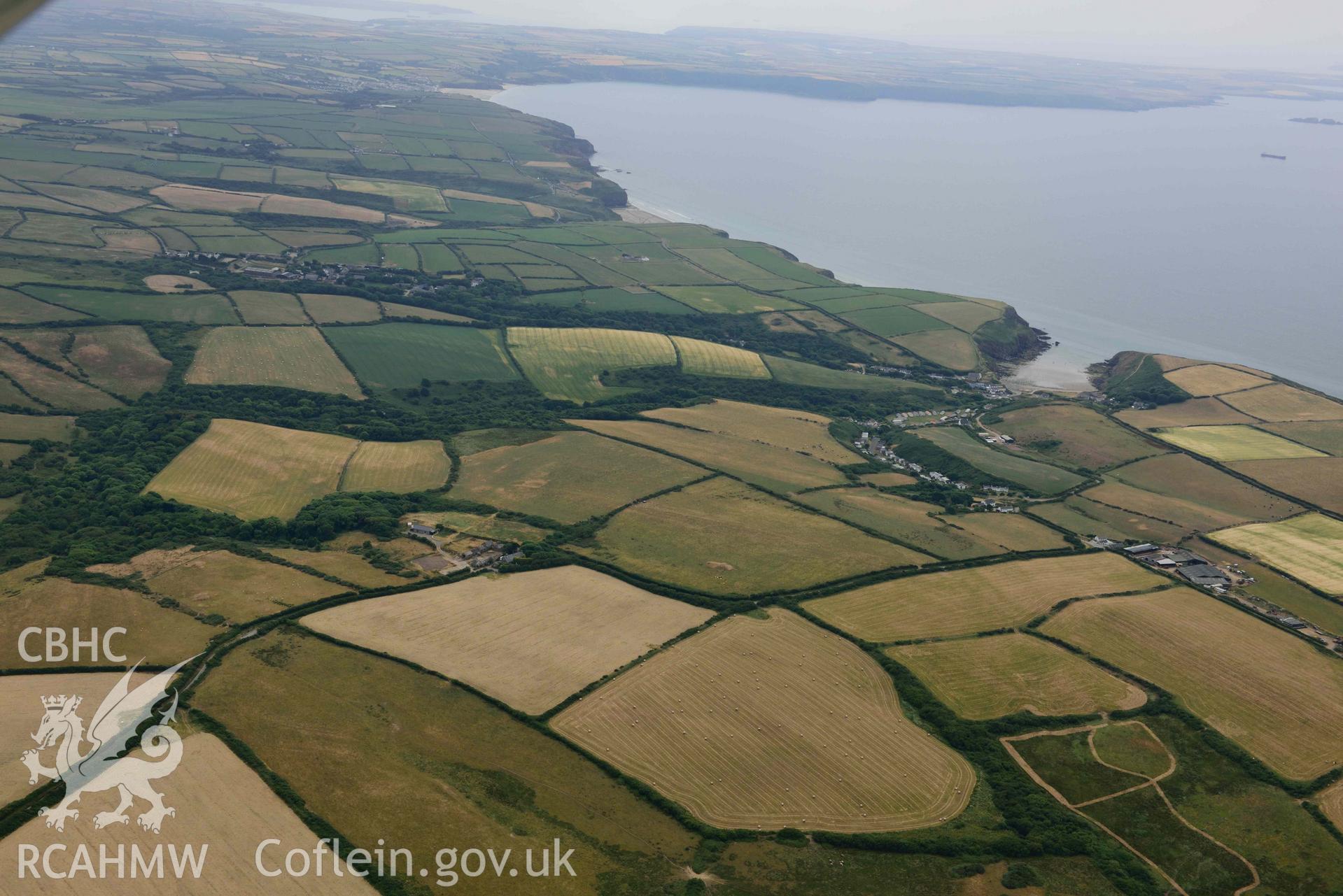 RCAHMW colour oblique aerial photograph of Nolton Haven village, with geoloigcal cropmarks taken on 11 July 2018 by Toby Driver