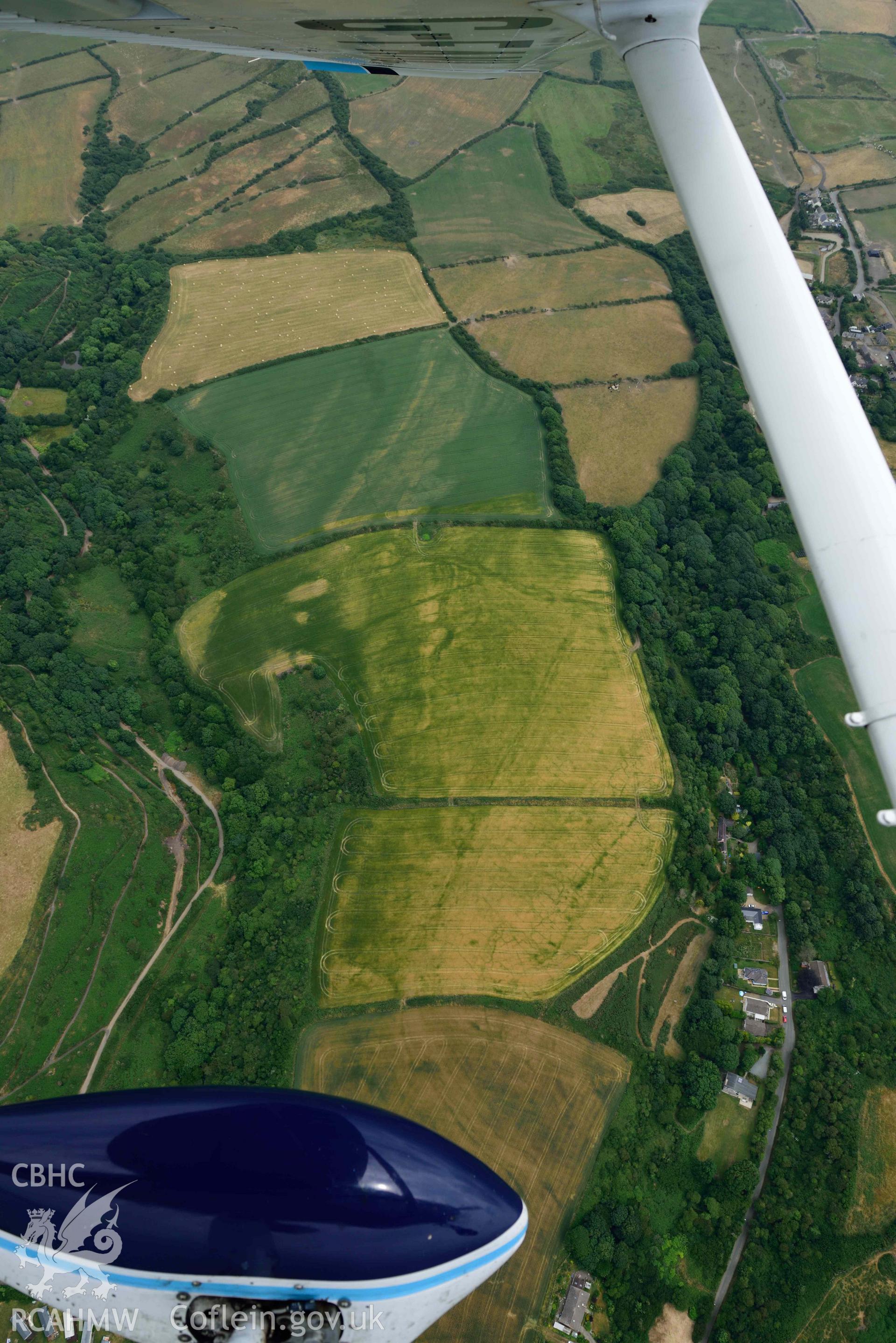 RCAHMW colour oblique aerial photograph of Nolton Haven village, with geoloigcal cropmarks taken on 11 July 2018 by Toby Driver