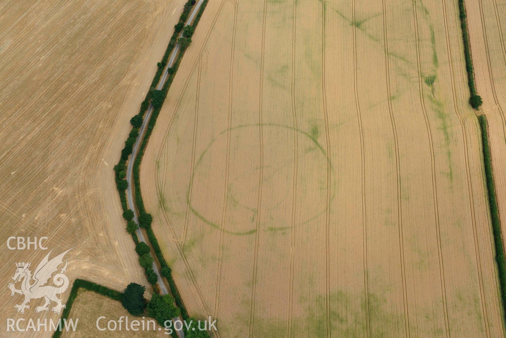 RCAHMW colour oblique aerial photograph of Cawrence enclosure taken on 11 July 2018 by Toby Driver