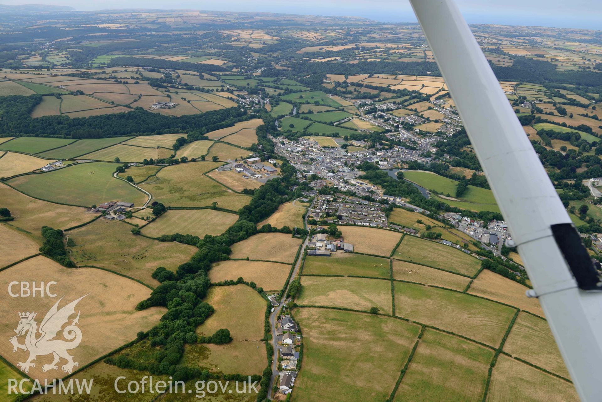 RCAHMW colour oblique aerial photograph of Newcastle Emlyn town & natural cropmarks to South taken on 11 July 2018 by Toby Driver