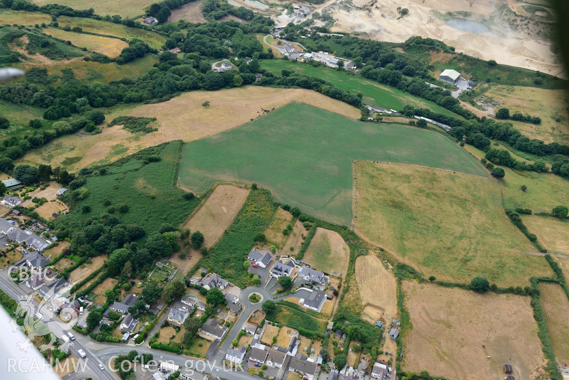 RCAHMW colour oblique aerial photograph of Penparc Defended Enclosure taken on 11 July 2018 by Toby Driver