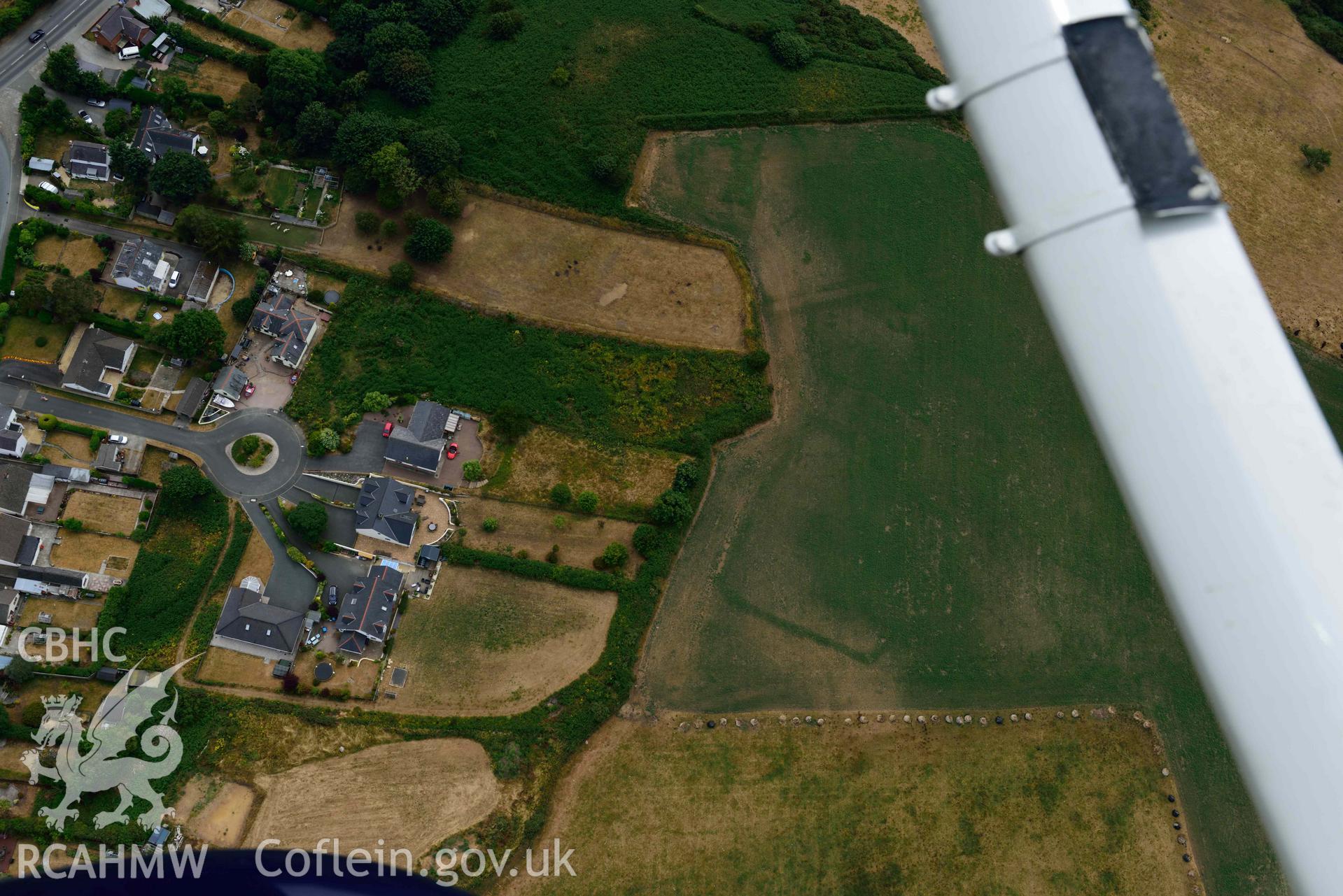 RCAHMW colour oblique aerial photograph of Penparc Defended Enclosure taken on 11 July 2018 by Toby Driver