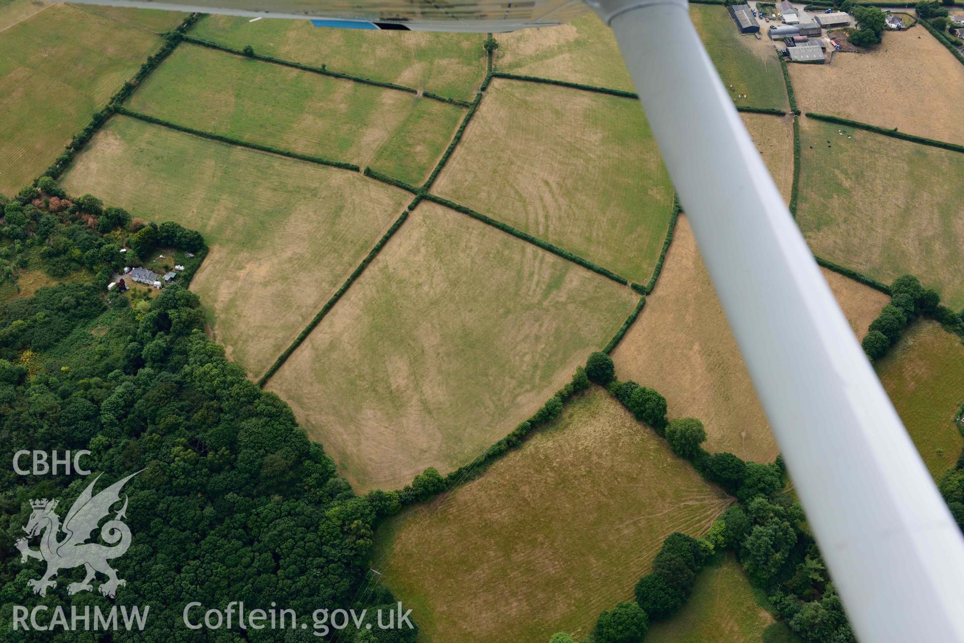 RCAHMW colour oblique aerial photograph of Newcastle Emlyn town & natural cropmarks to South taken on 11 July 2018 by Toby Driver