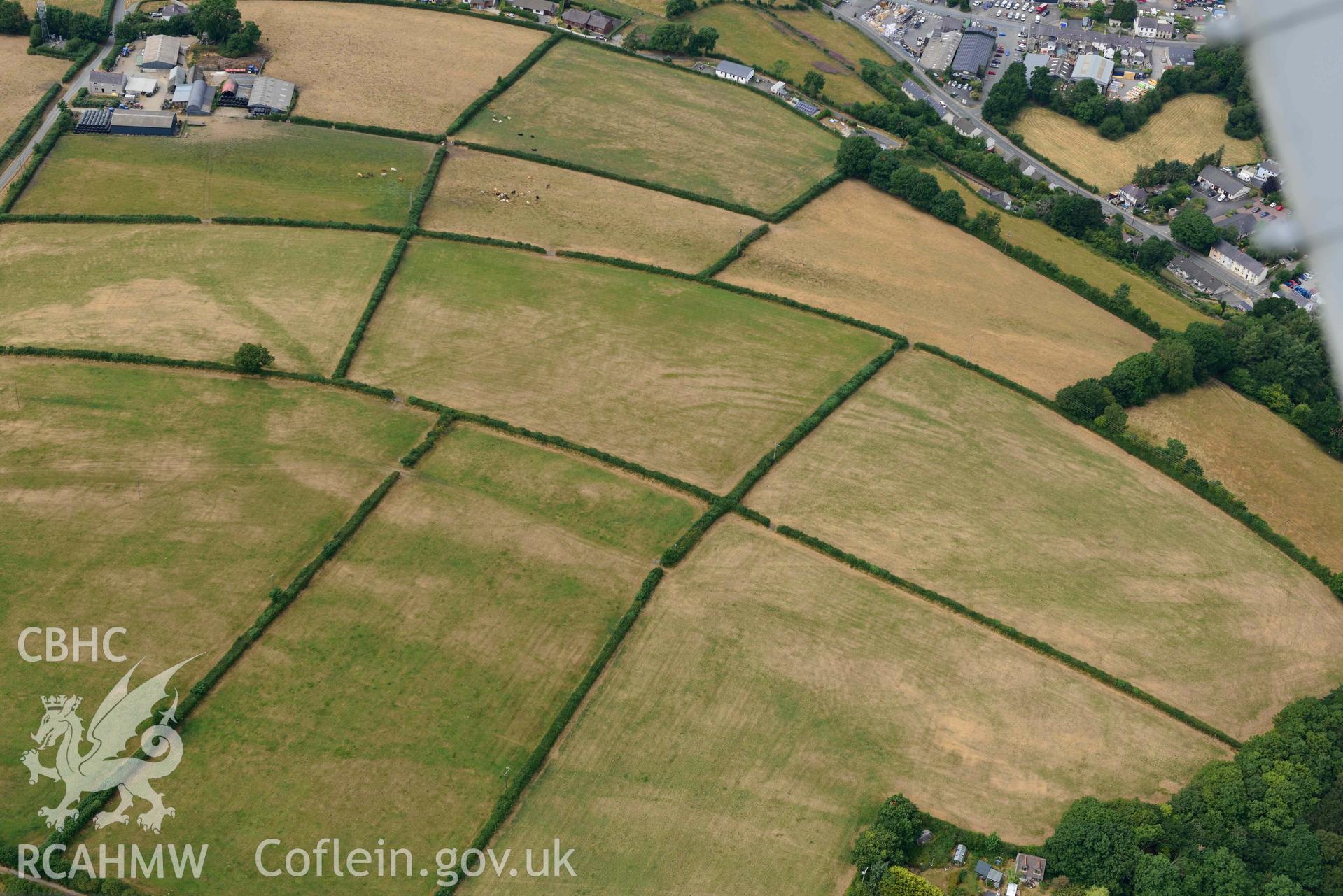 RCAHMW colour oblique aerial photograph of Newcastle Emlyn town & natural cropmarks to South taken on 11 July 2018 by Toby Driver