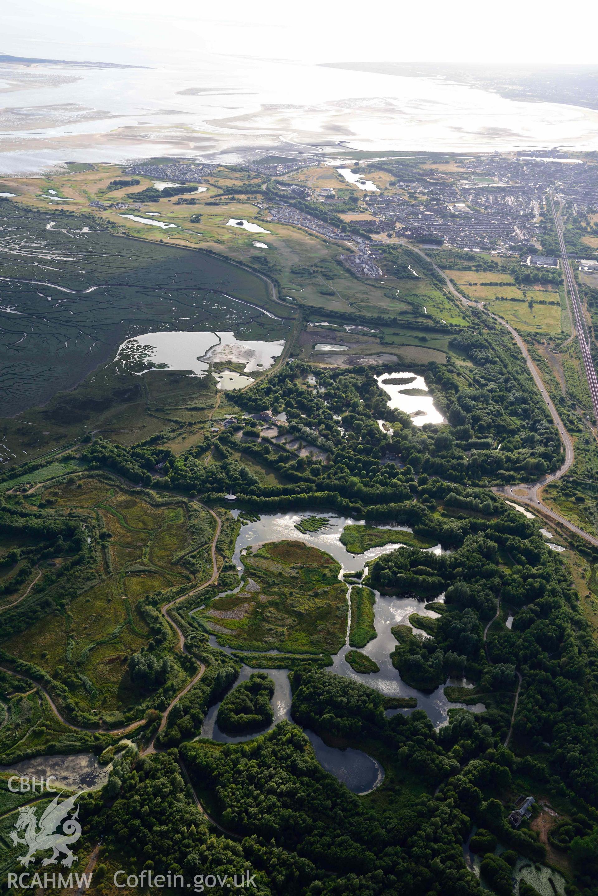 RCAHMW colour oblique aerial photograph of Llanelli,  Wetlands Centre taken on 17 July 2018 by Toby Driver