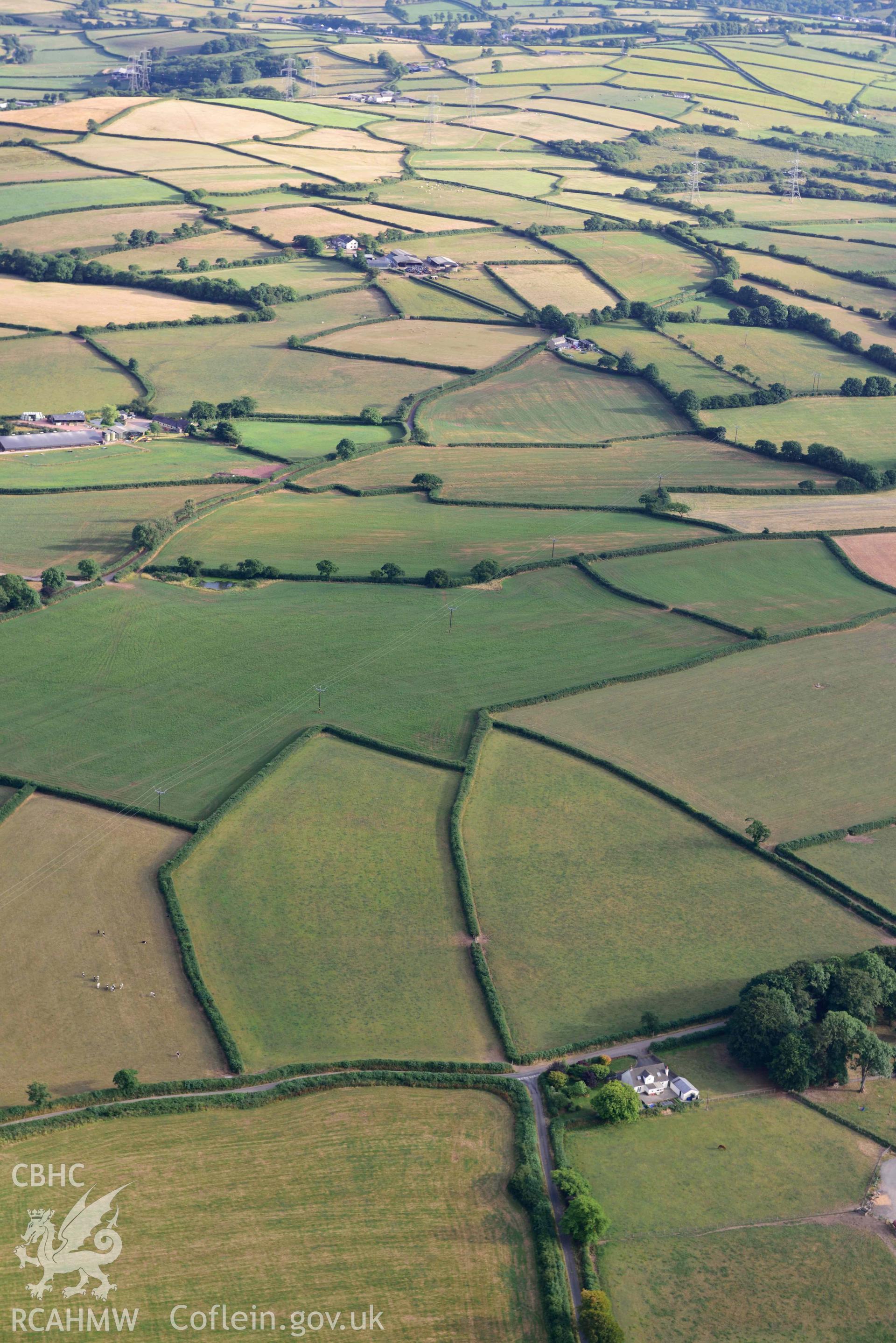 RCAHMW colour oblique aerial photograph of Roman road from Carmarthen to Kidwelly taken on 17 July 2018 by Toby Driver