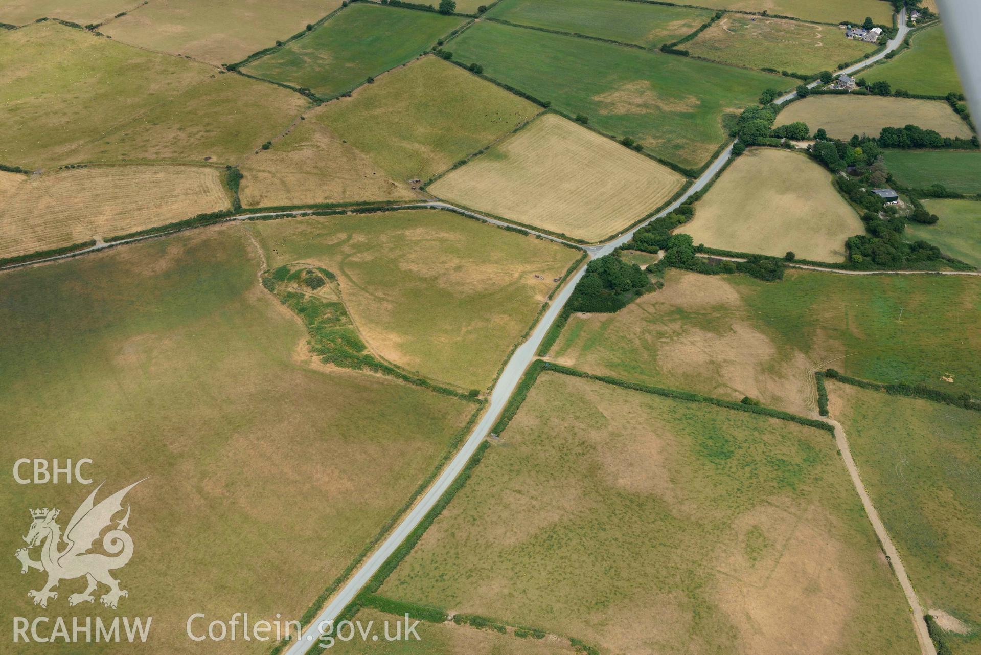 RCAHMW colour oblique aerial photograph of Crugiau Cemmaes Barrow Cemetary + Crugiau Cemmaes Banjo enclosure taken on 11 July 2018 by Toby Driver