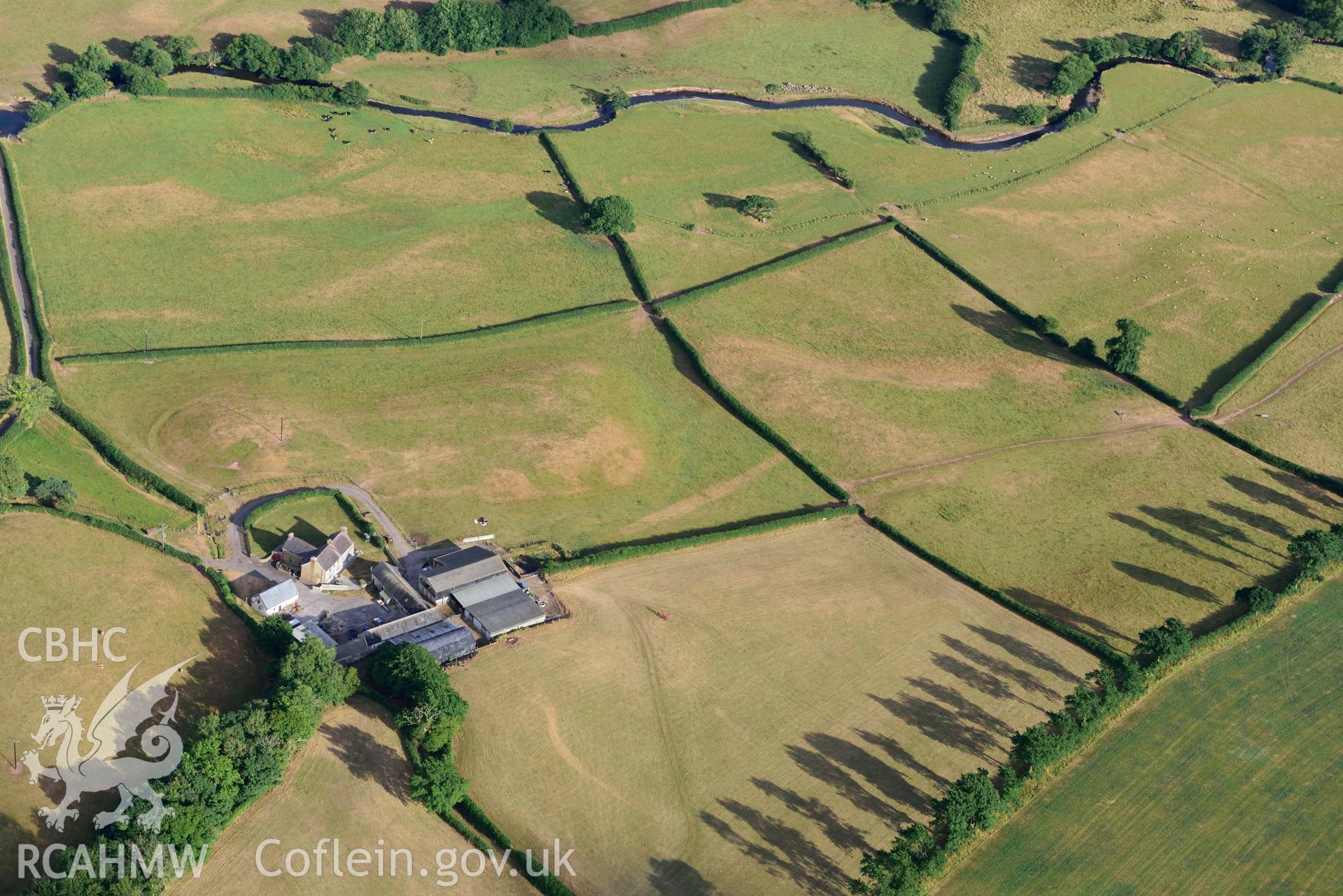 RCAHMW colour oblique aerial photograph of Roman road from Carmarthen to Kidwelly; Road parchmarks south of Nantllan taken on 17 July 2018 by Toby Driver (NGR: SN411150)