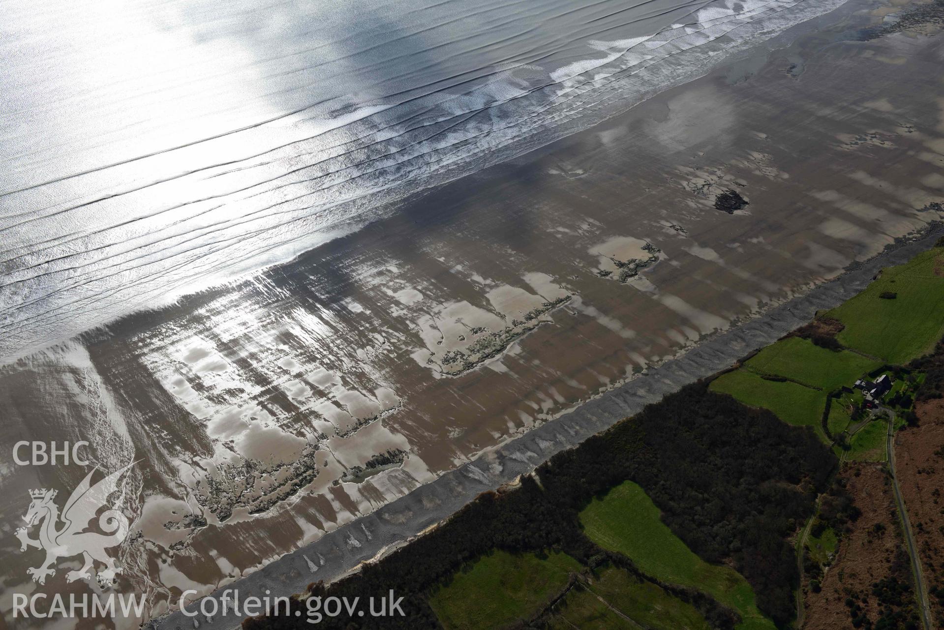 RCAHMW colour oblique aerial photograph of Marros Sands, peat deposits, south of Underhill taken on 4 March 2022 by Toby Driver ((SN202074)