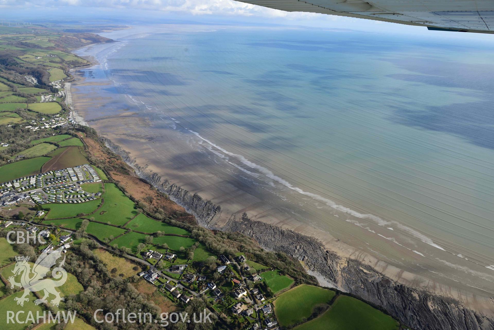 RCAHMW colour oblique aerial photograph of Wiseman's Bridge, coastal exposures following storms, looking east taken on 4 March 2022 by Toby Driver ((SN146060)