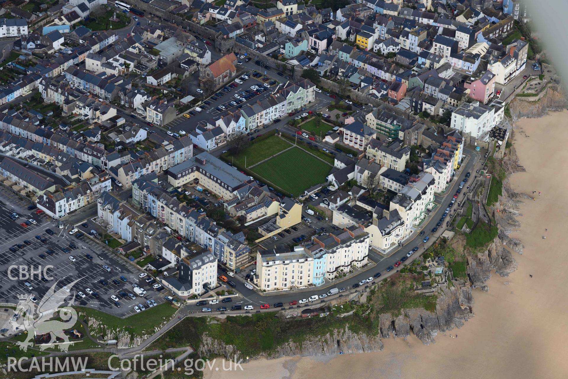 RCAHMW colour oblique aerial photograph of Tenby town with the Esplanade and bowling green taken on 4 March 2022 by Toby Driver ((SN133001)