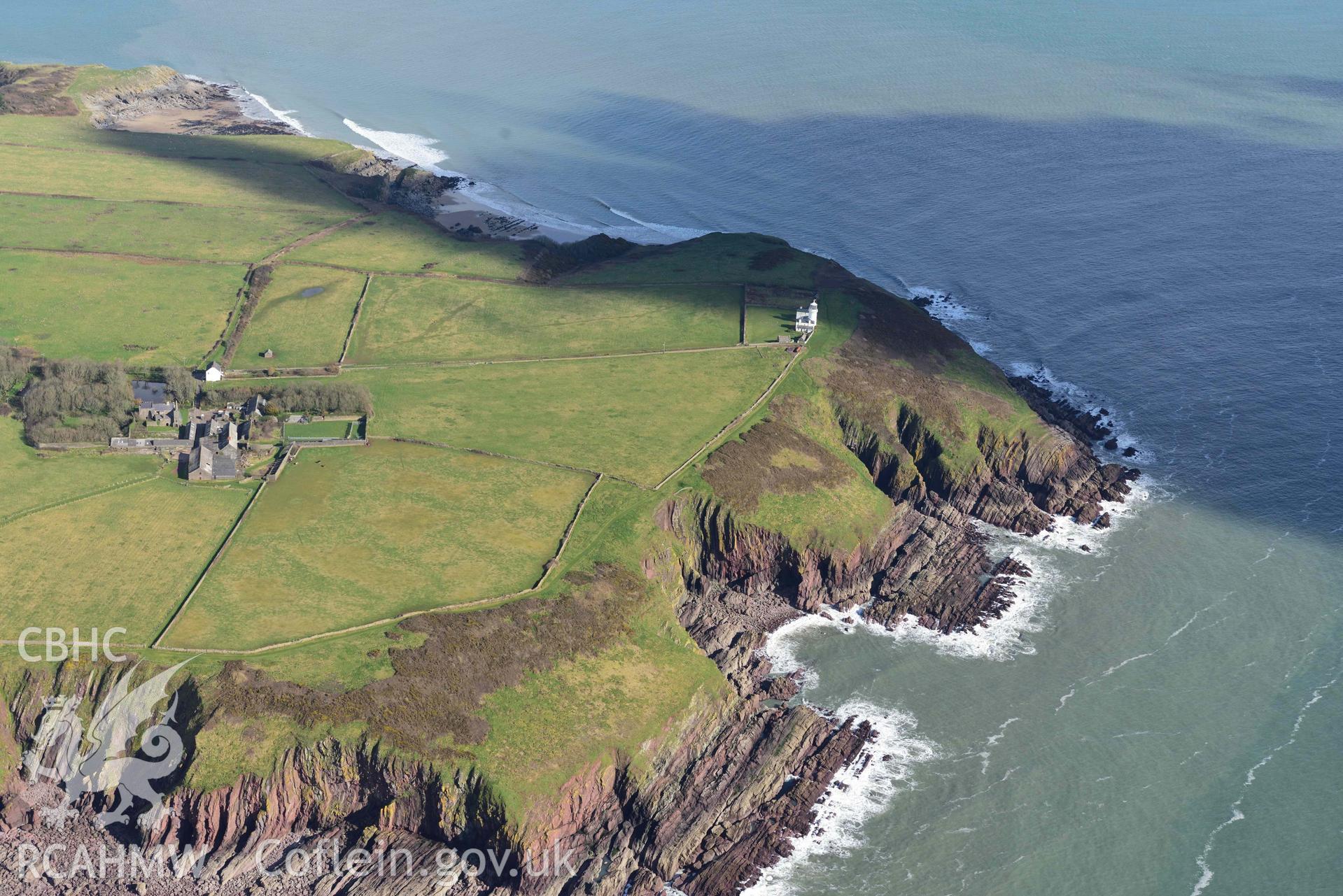 RCAHMW colour oblique aerial photograph of Caldey Lighthouse, and Priory taken on 4 March 2022 by Toby Driver ((SS143959)