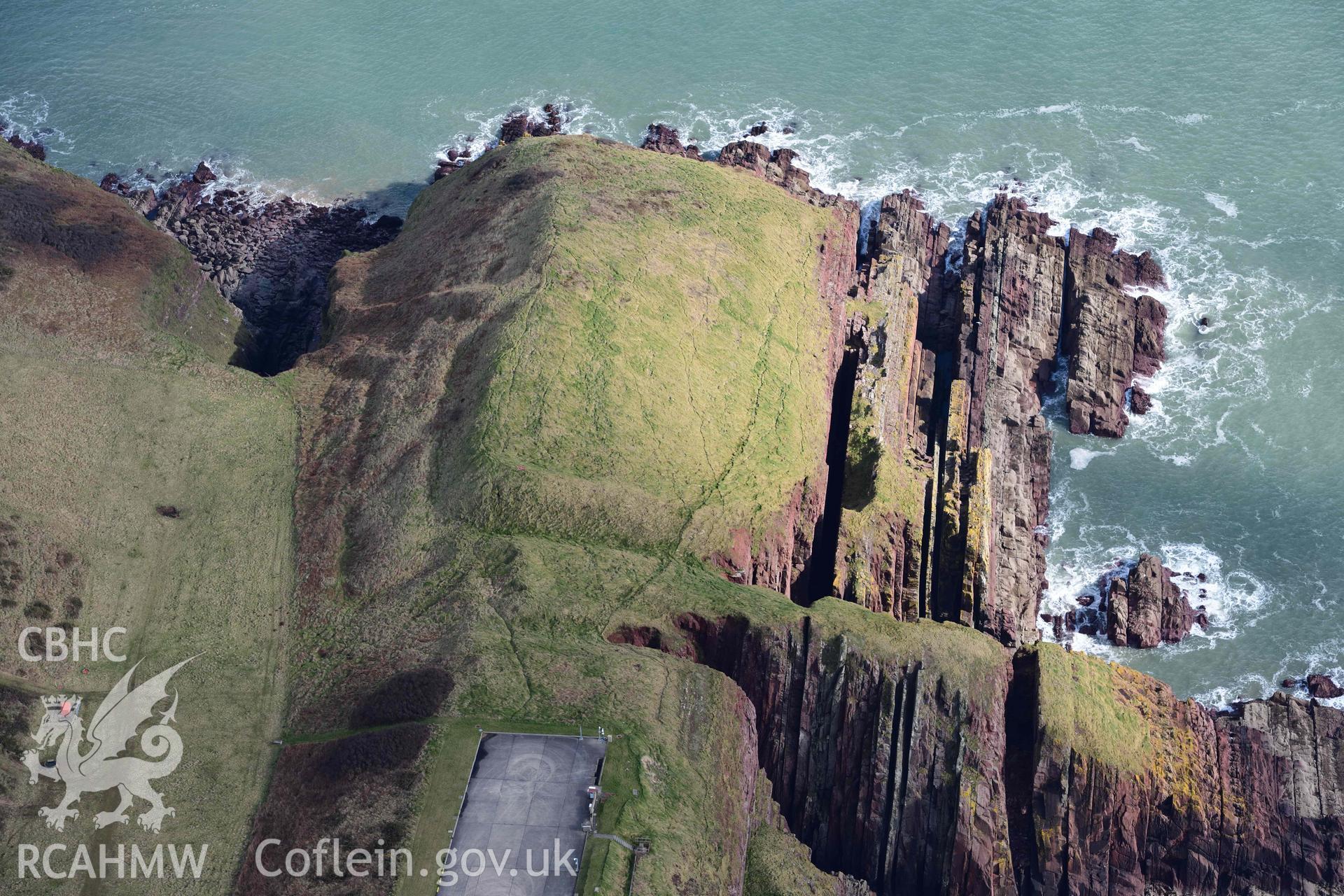 RCAHMW colour oblique aerial photograph of Old Castle Head promontory fort taken on 4 March 2022 by Toby Driver ((SS075966)