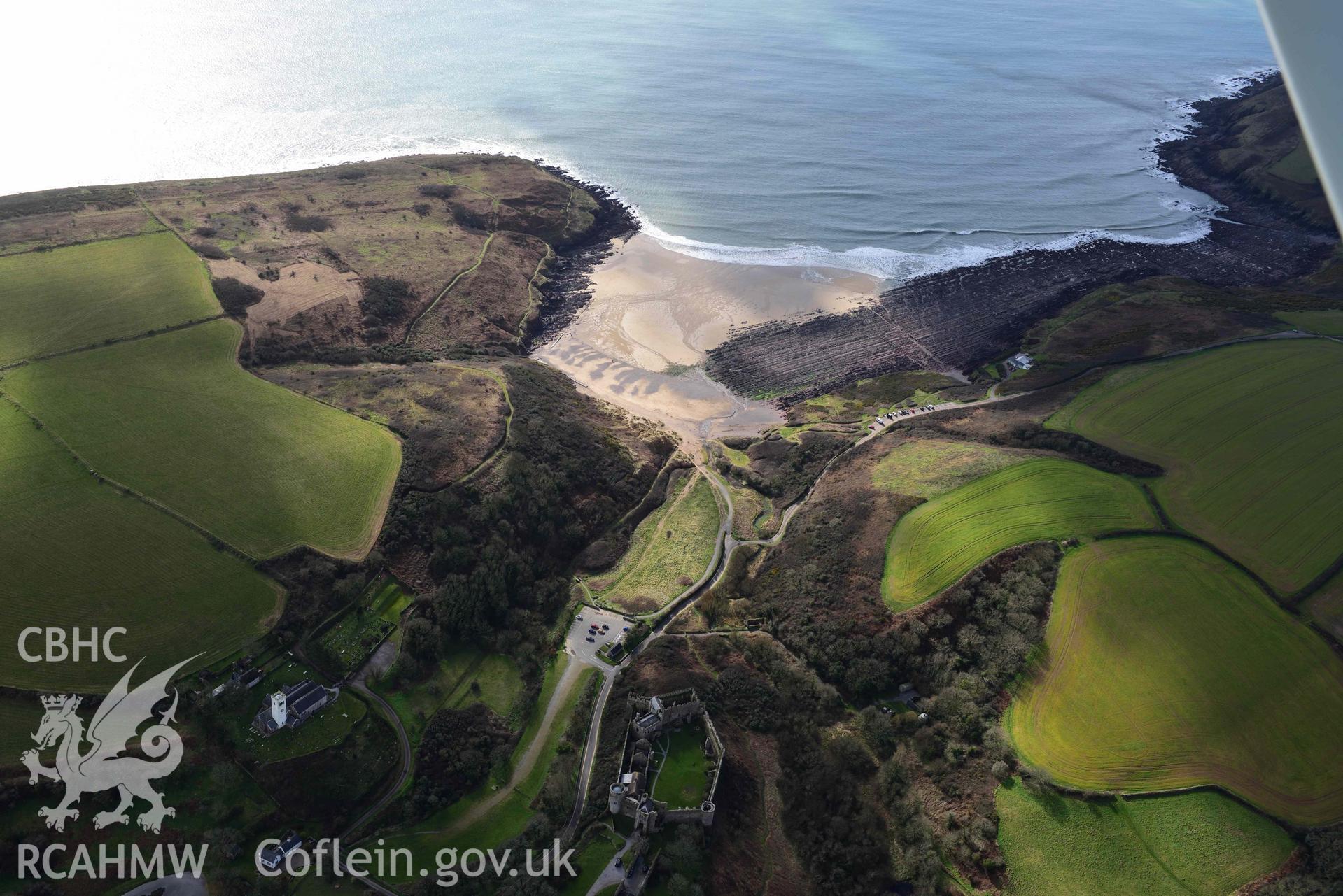 RCAHMW colour oblique aerial photograph of Manorbier Castle & Bay taken on 4 March 2022 by Toby Driver ((SS063979)