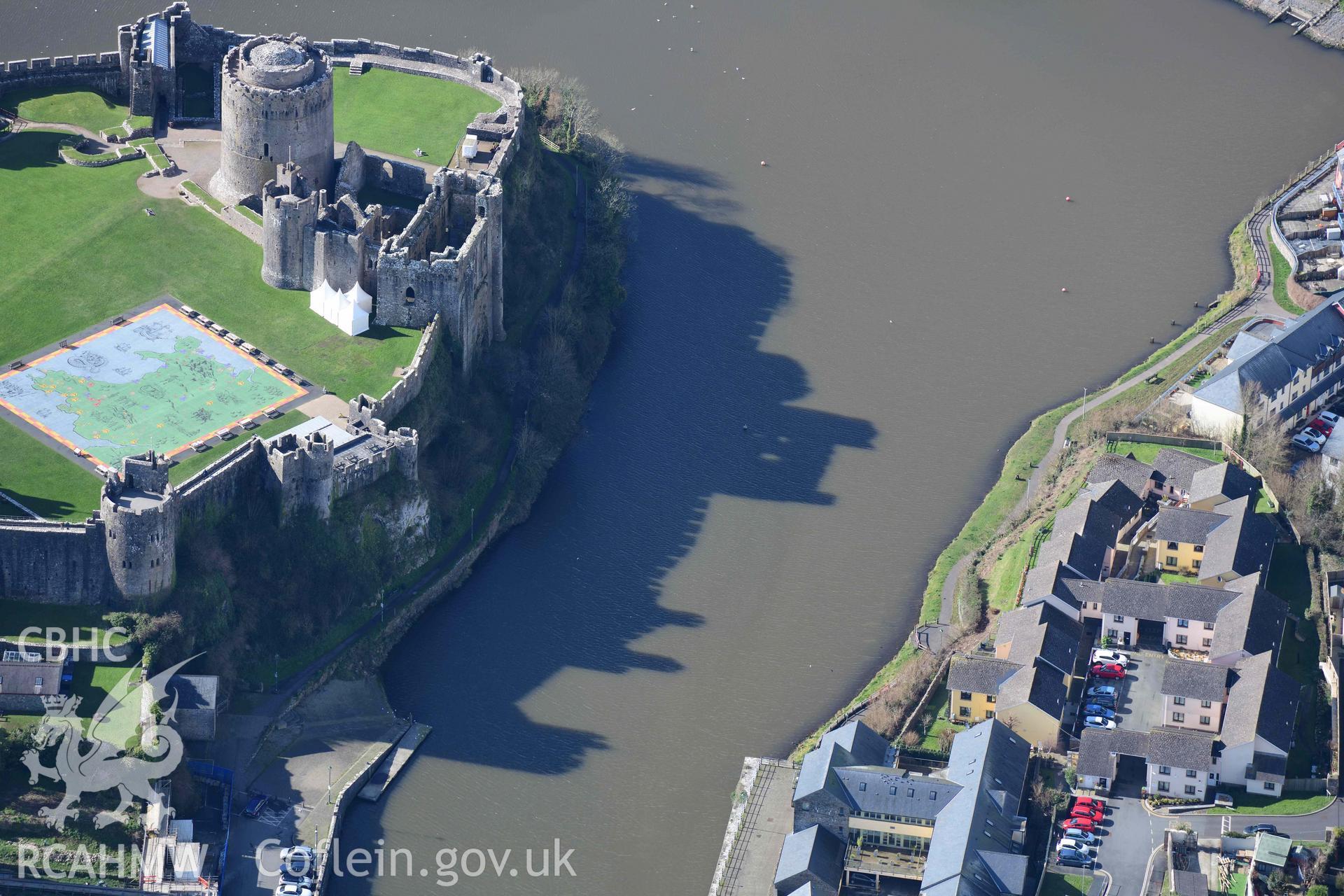 RCAHMW colour oblique aerial photograph of Pembroke Castle, casting shadows to north taken on 4 March 2022 by Toby Driver ((SM981016)