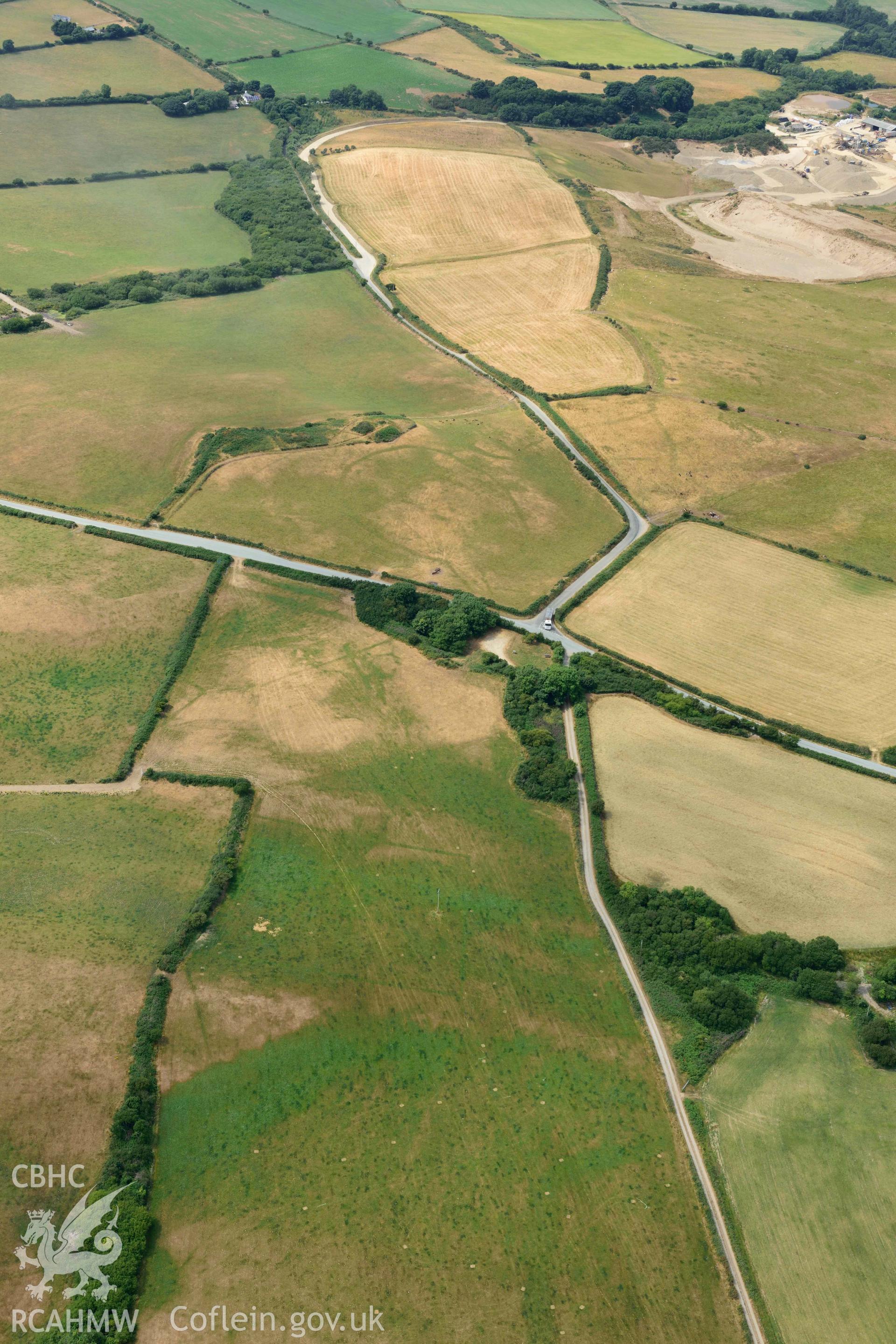 RCAHMW colour oblique aerial photograph of Crugiau Cemmaes Barrow Cemetary + Crugiau Cemmaes Banjo enclosure taken on 11 July 2018 by Toby Driver