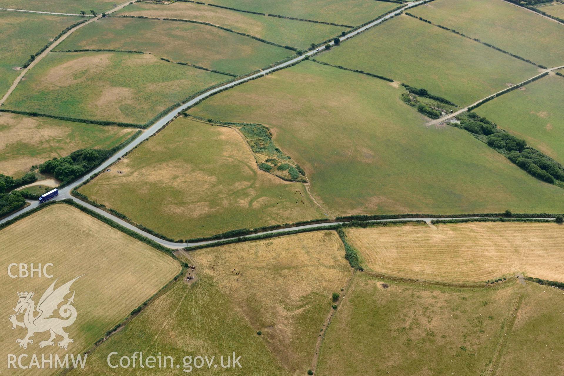 RCAHMW colour oblique aerial photograph of Crugiau Cemmaes Barrow Cemetary + Crugiau Cemmaes Banjo enclosure taken on 11 July 2018 by Toby Driver