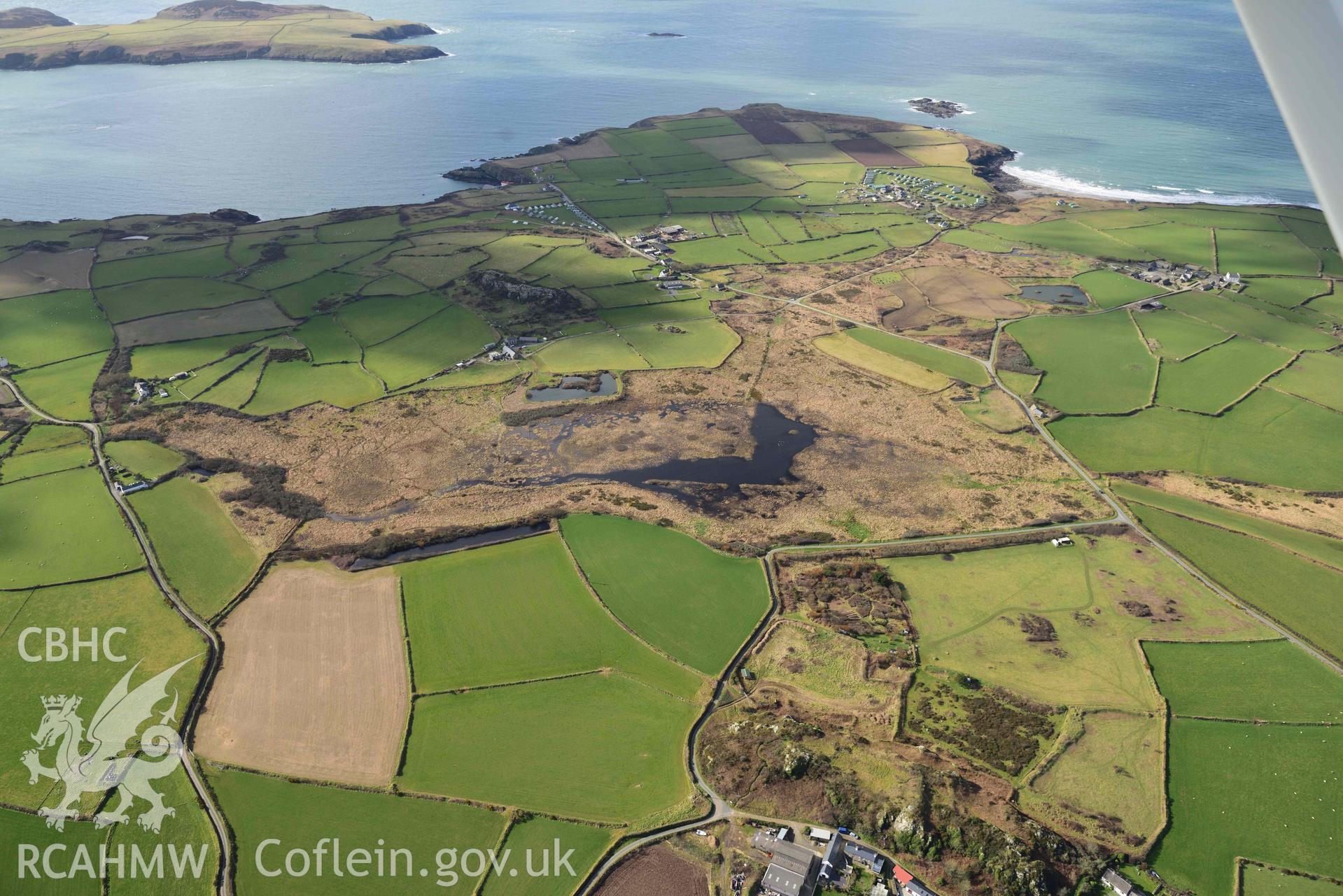 RCAHMW colour oblique aerial photograph of Clegyr-Boia defended settlement, with landscape to SW taken on 4 March 2022 by Toby Driver ((SM737250)