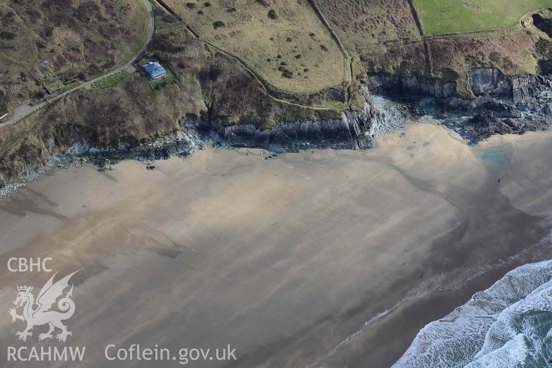 RCAHMW colour oblique aerial photograph of Whitesands Bay, Porth-mawr, south part of beach taken on 4 March 2022 by Toby Driver ((SM731267)