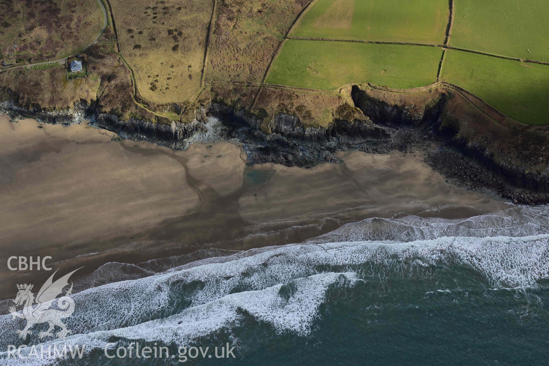 RCAHMW colour oblique aerial photograph of Whitesands Bay, Porth-mawr, south part of beach taken on 4 March 2022 by Toby Driver ((SM731267)