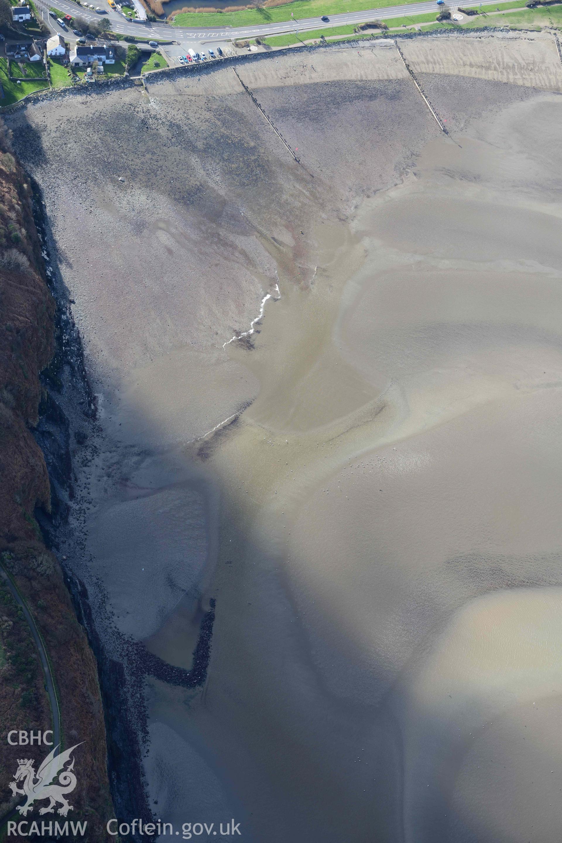 RCAHMW colour oblique aerial photograph of Fishguard harbour south-east fish trap taken on 4 March 2022 by Toby Driver ((SM952377)