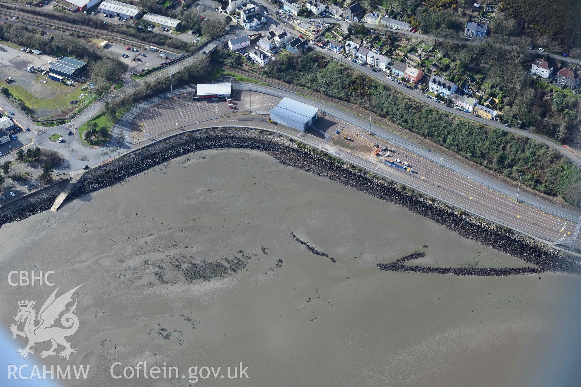 RCAHMW colour oblique aerial photograph of Fishguard harbour, north-west fish trap taken on 4 March 2022 by Toby Driver ((SM948383)