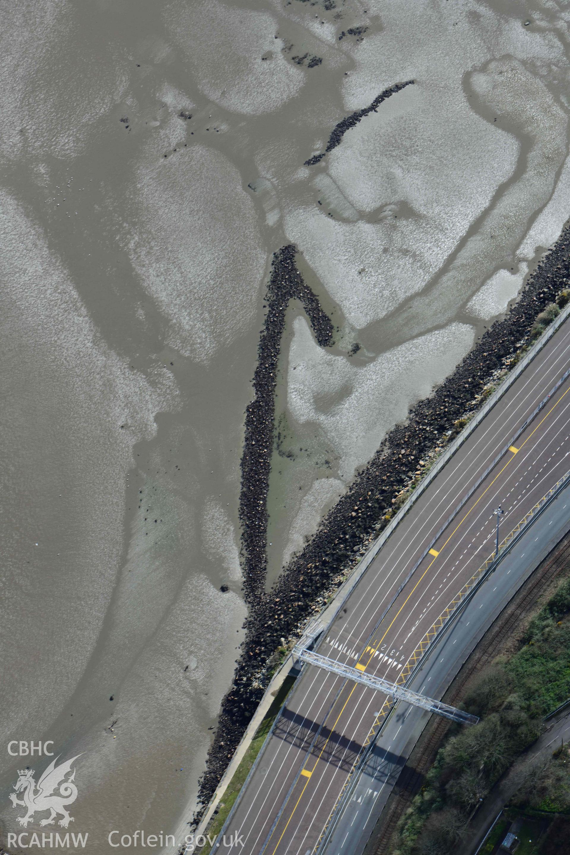 RCAHMW colour oblique aerial photograph of Fishguard harbour, north-west fish trap taken on 4 March 2022 by Toby Driver ((SM948383)