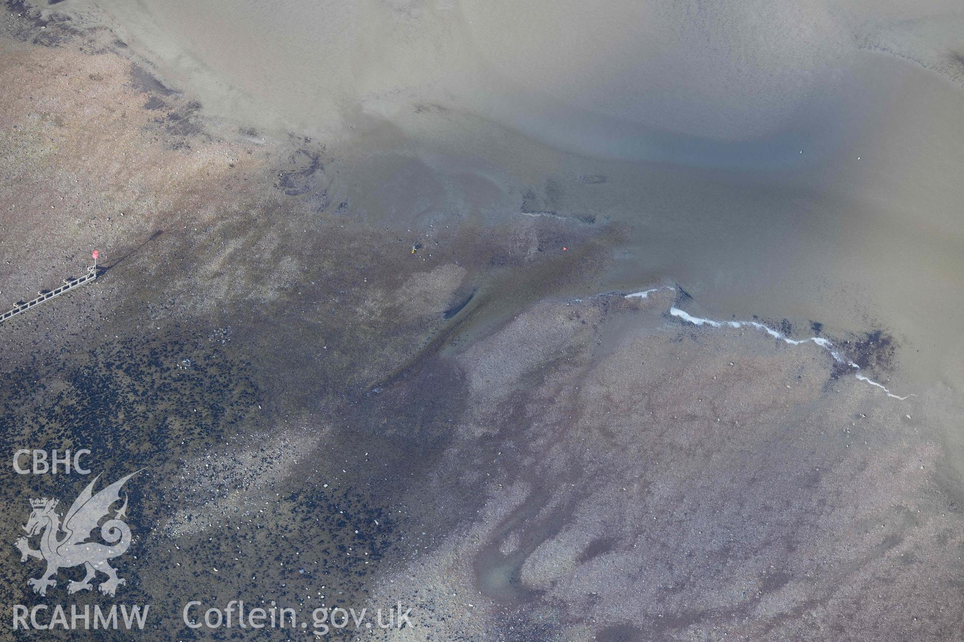 RCAHMW colour oblique aerial photograph of Fishguard harbour, site of wreck of Lizzie Edith taken on 4 March 2022 by Toby Driver ((SM951377)