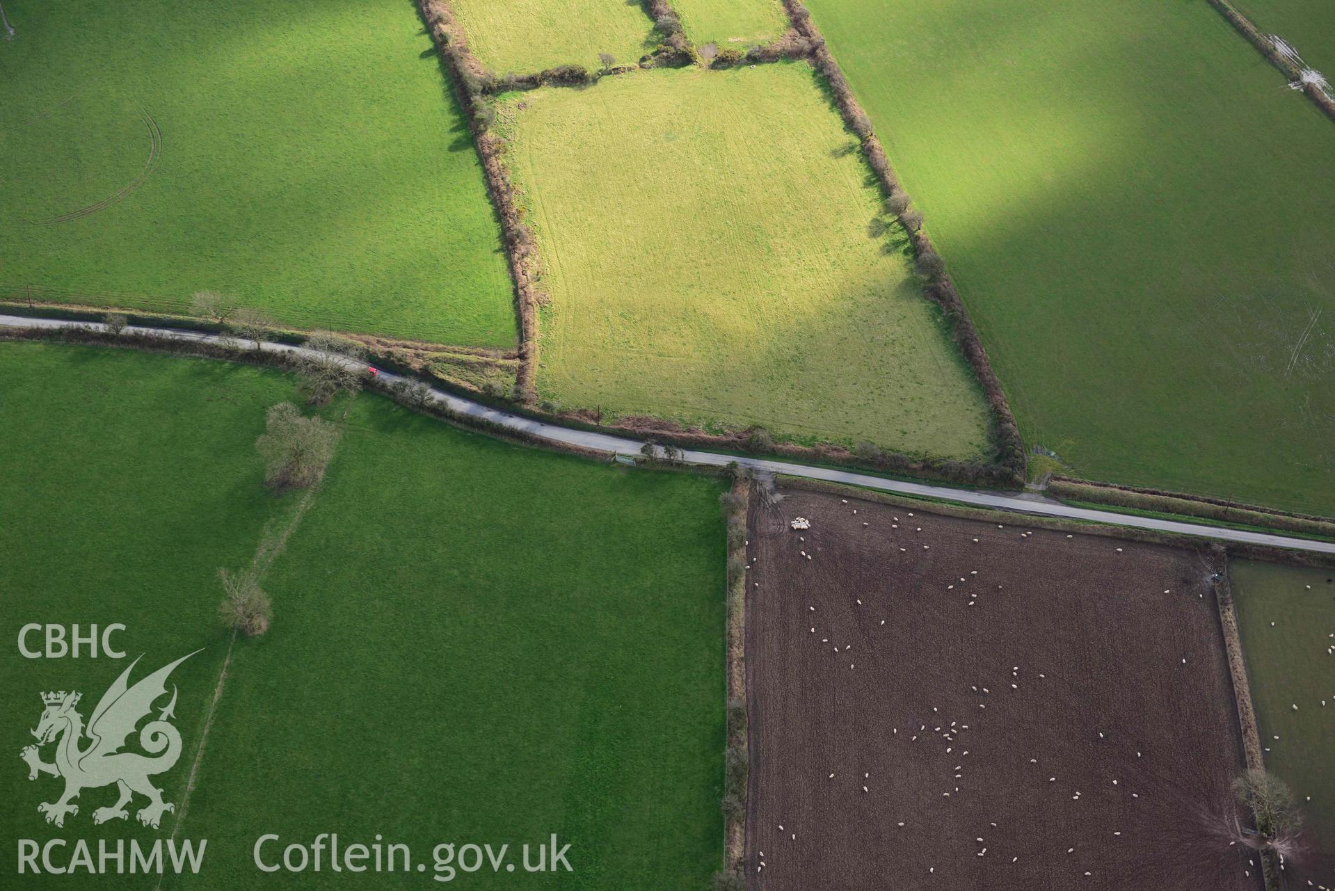 RCAHMW colour oblique aerial photograph of Castle Flemish, enclosure and villa taken on 4 March 2022 by Toby Driver ((SN007267)