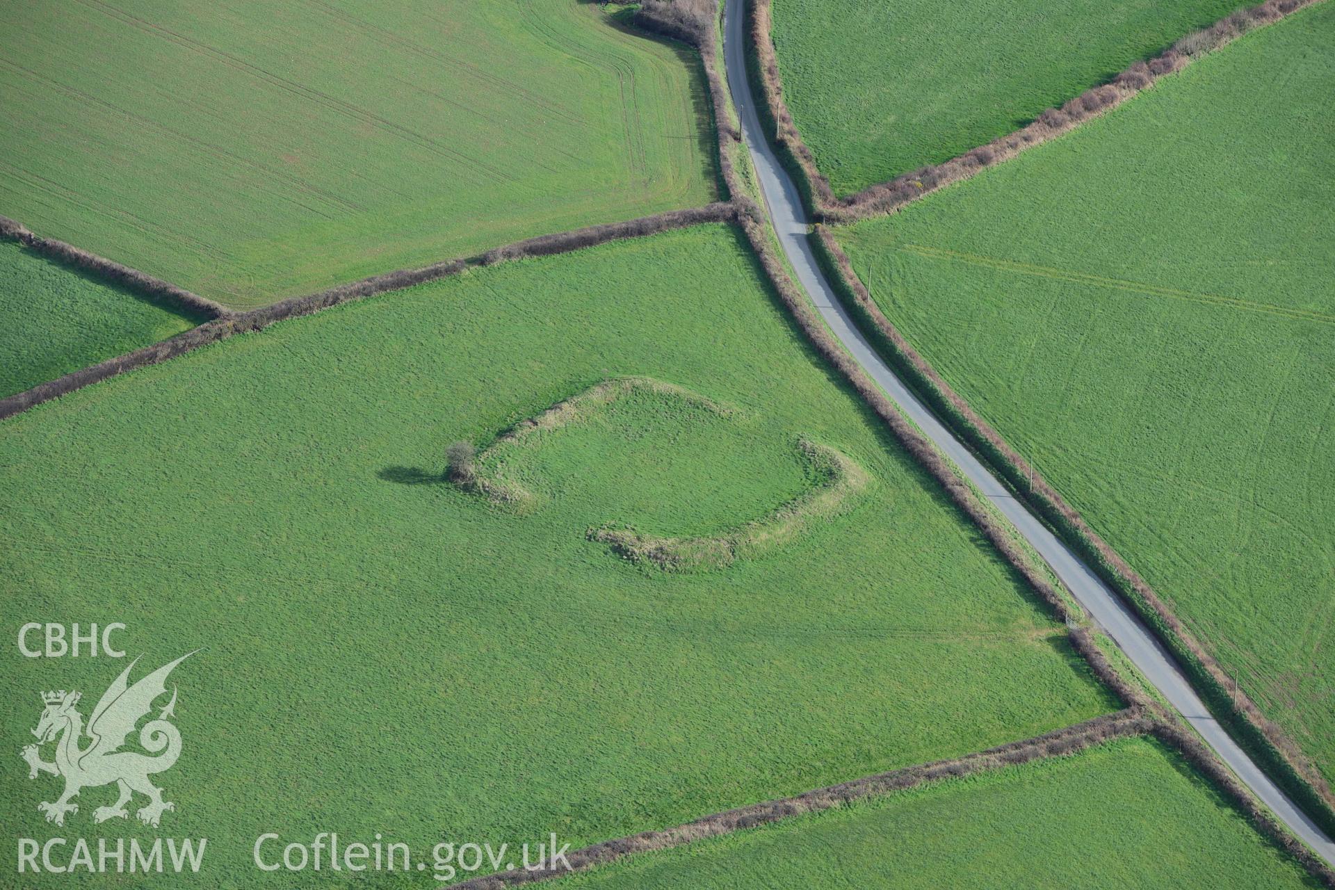 RCAHMW colour oblique aerial photograph of Knock Rath defended enclosure taken on 4 March 2022 by Toby Driver ((SN038216)