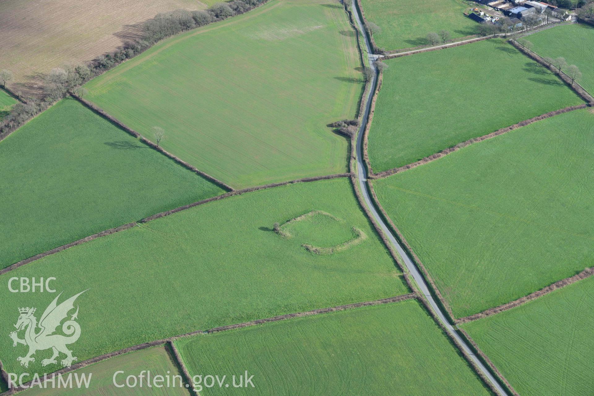 RCAHMW colour oblique aerial photograph of Knock Rath defended enclosure taken on 4 March 2022 by Toby Driver ((SN038216)