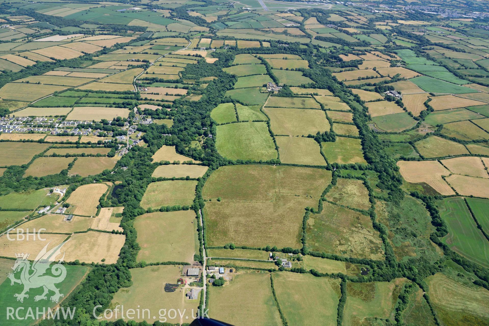 RCAHMW colour oblique aerial photograph of  Camrose village and castle taken on 9 July 2018 by Toby Driver