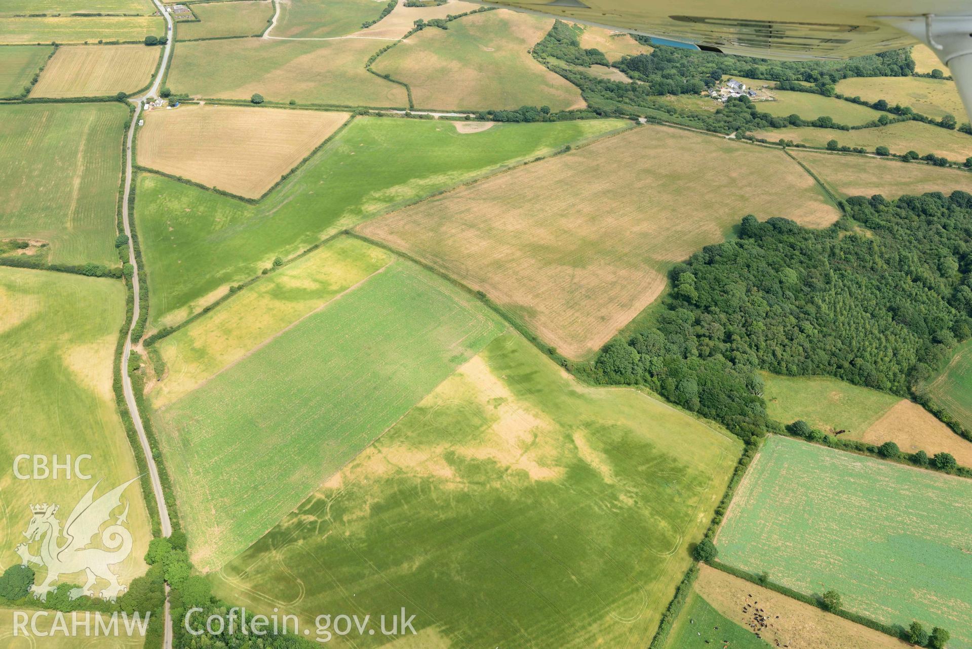 RCAHMW colour oblique aerial photograph of Causewayed enclosure, Dryslwyn taken on 11 July 2018 by Toby Driver